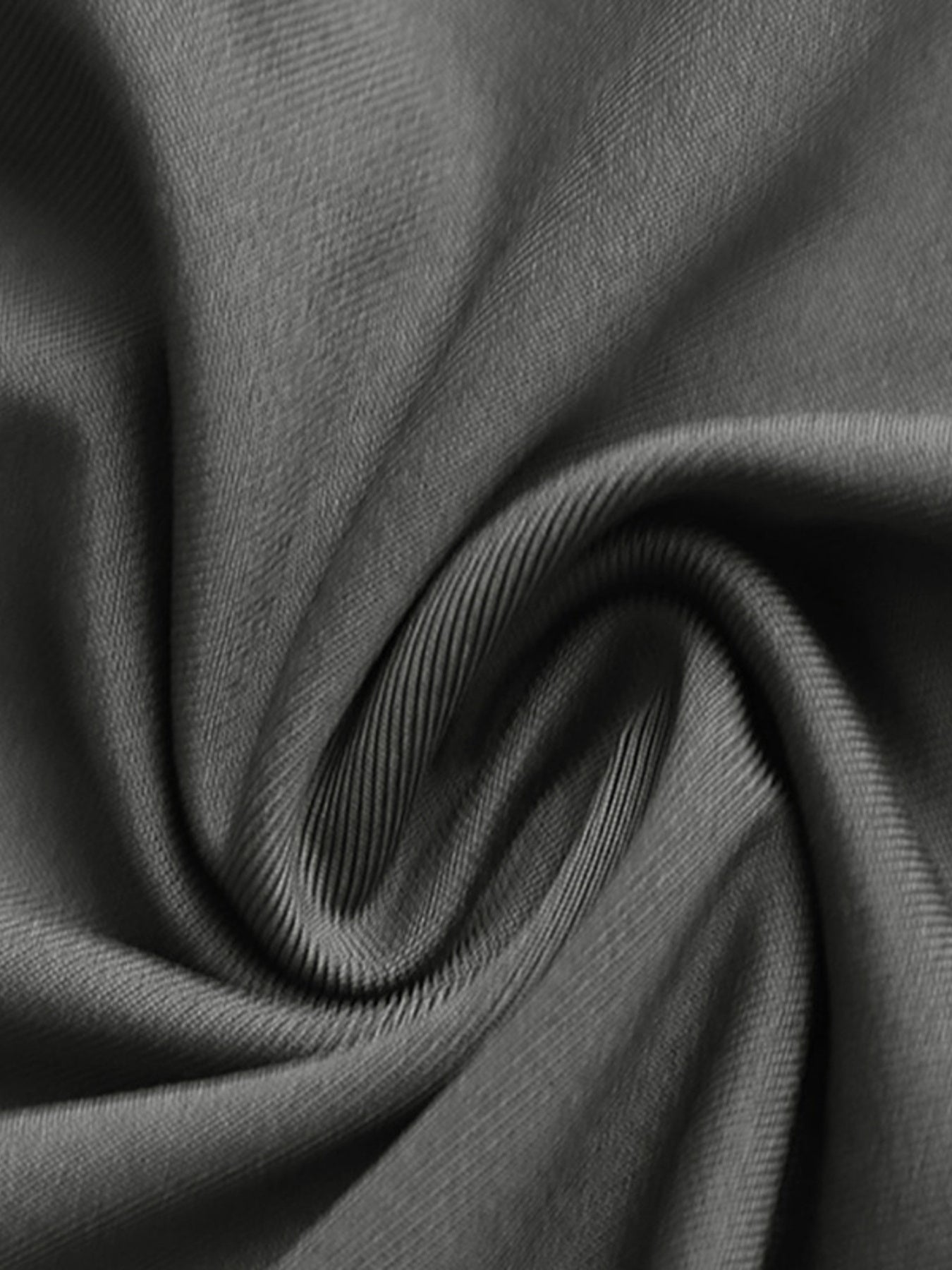 Close-up of dark gray fabric with folds