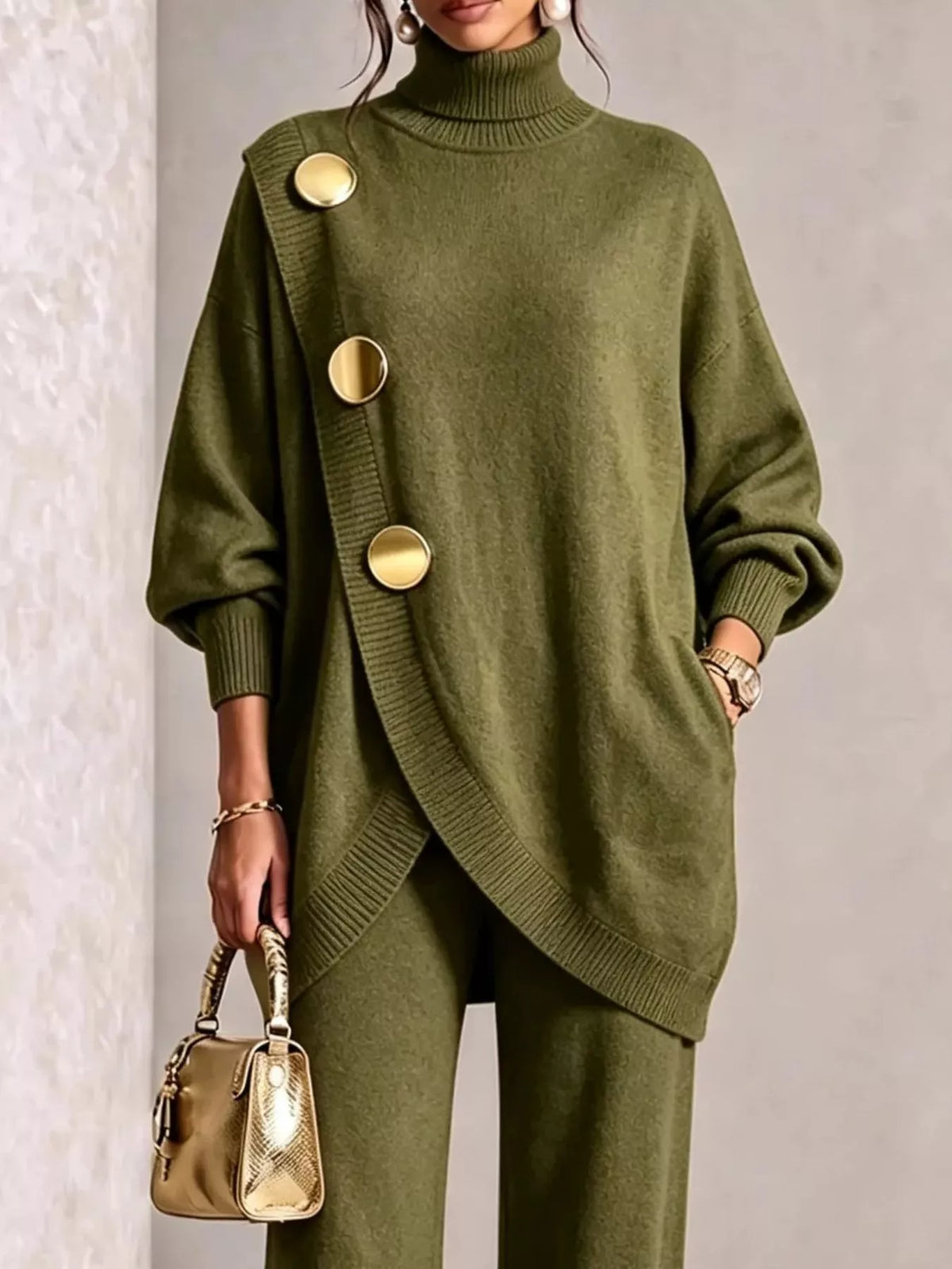 NEWYORKLISTED STYLE COLLECTION: A woman models an olive green knit turtleneck sweater with oversized decorative gold buttons and matching wide-leg knit pants, holding a small metallic gold handbag against a neutral textured wall.