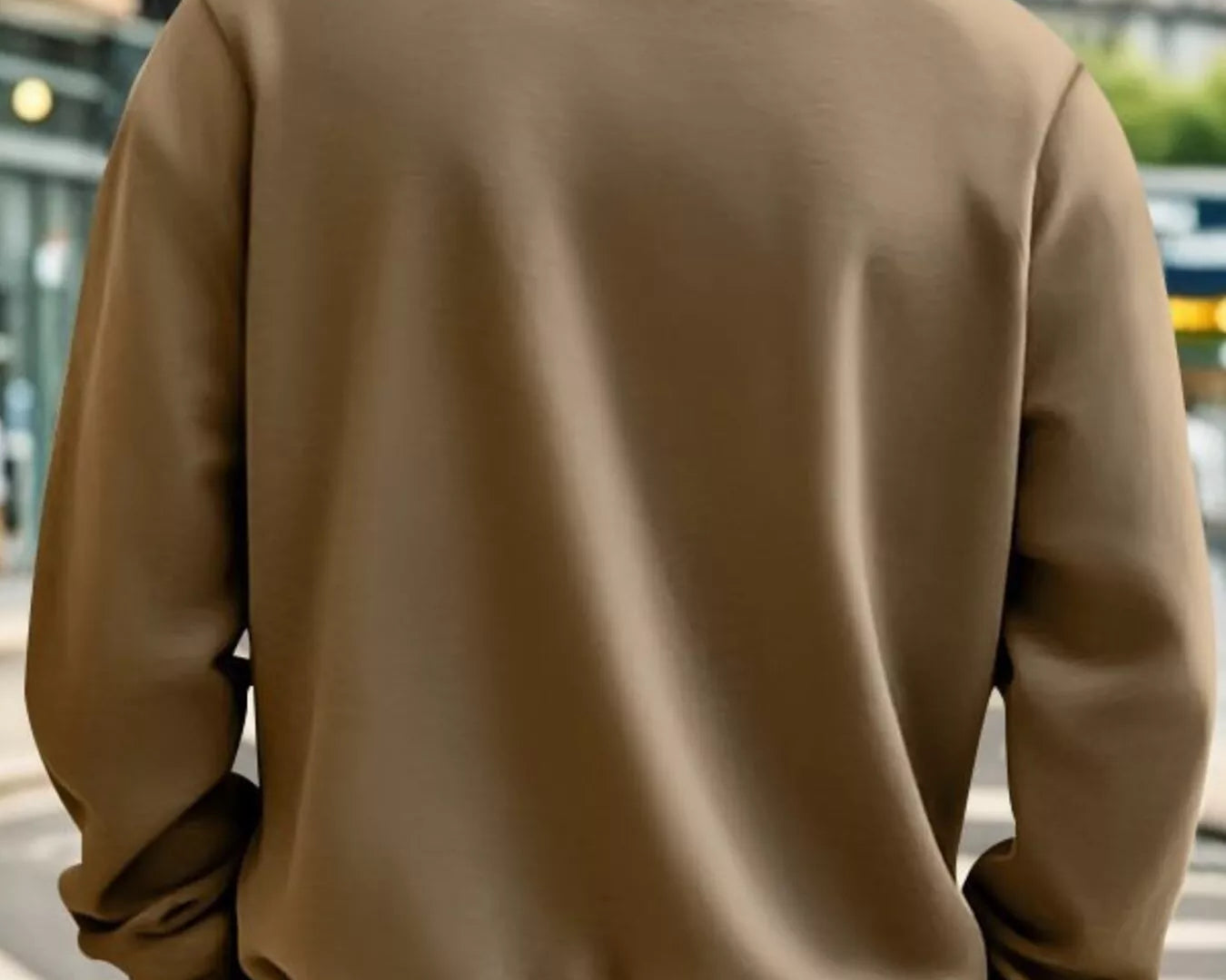 NEWYORKLISTED ATLAS MEN'S COLLECTION: Person wearing a brown jacket on a city street