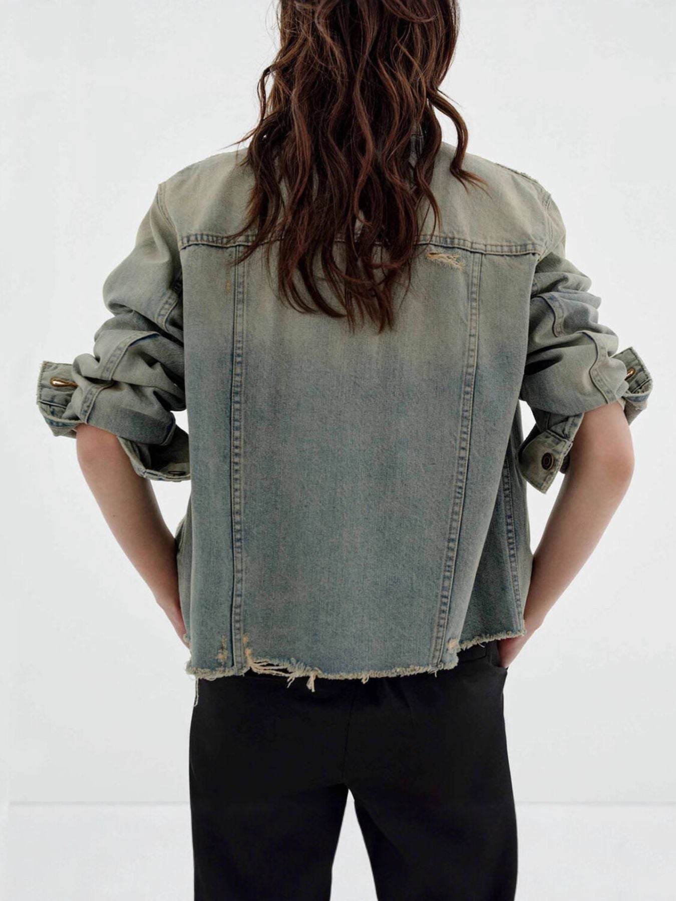 NEWYORKLISTED STYLE COLLECTION: Person wearing a light blue denim jacket on a white background