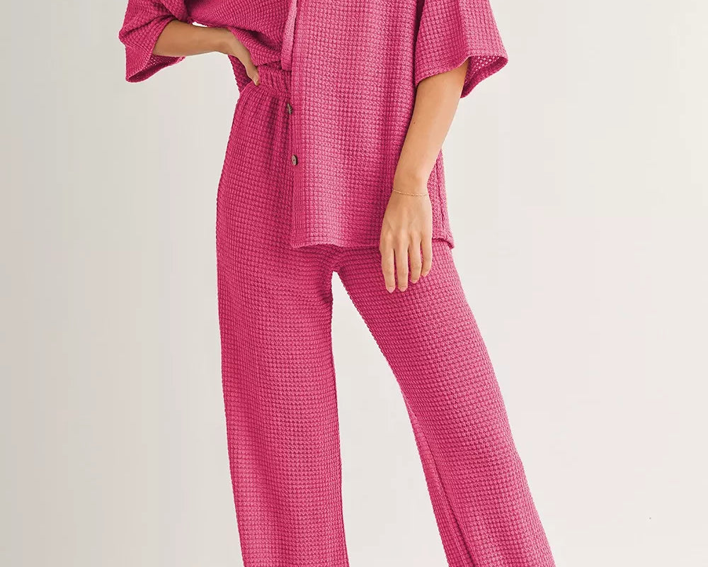 NEWYORKLISTED Comfort Collection: Woman wearing a pink checkered outfit on a white background