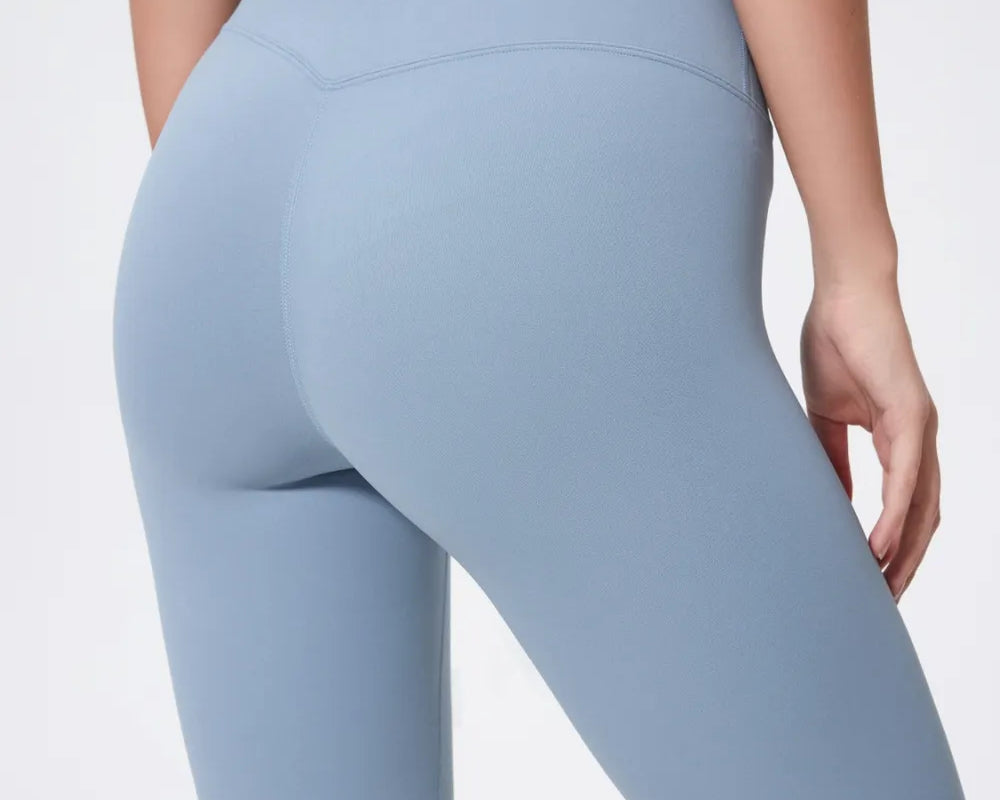 Light blue athletic shorts worn by a person on a plain background