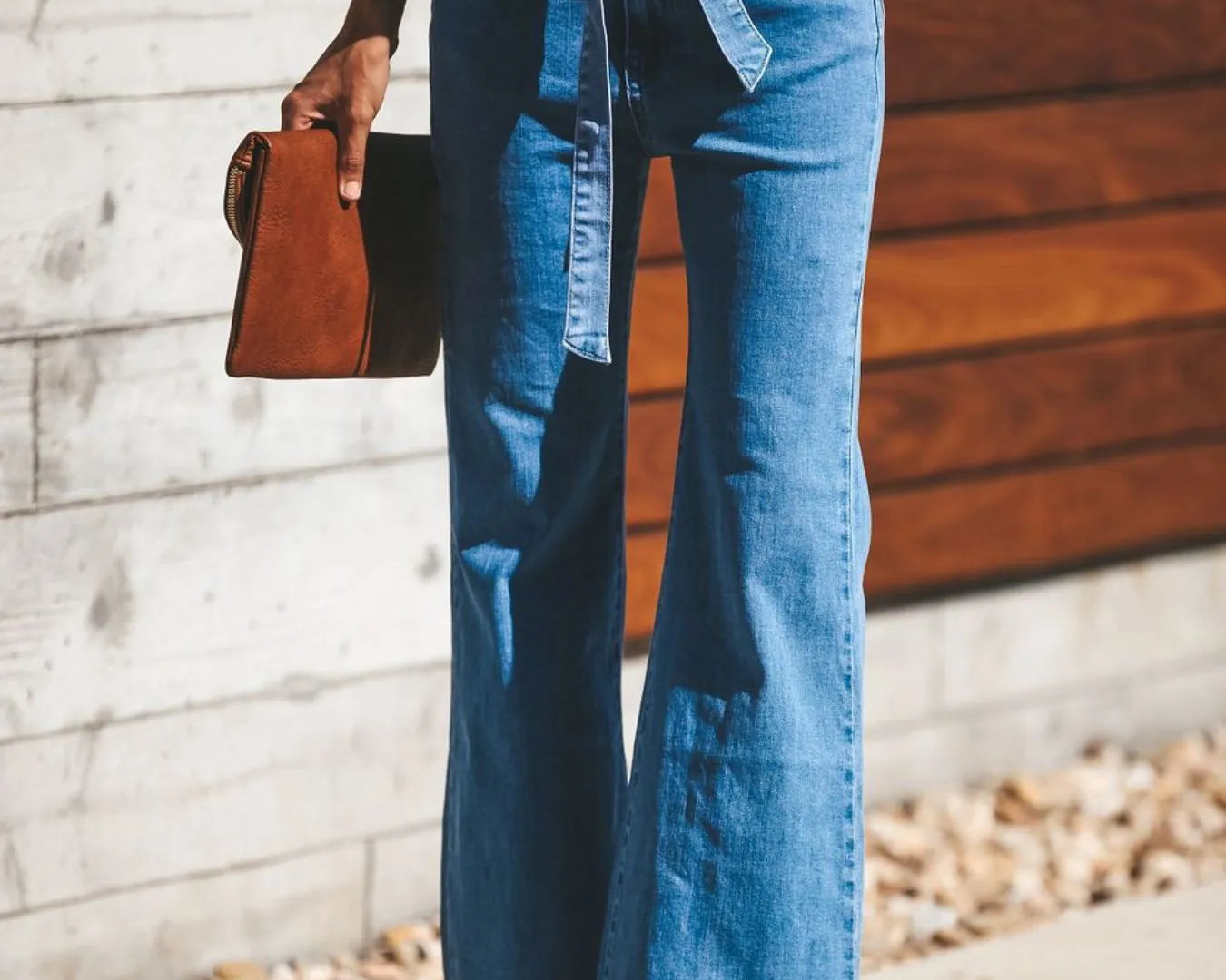 High-Waisted Tie-Front Flare Jeans from the NEWYORKLISTED STYLE COLLECTION. Waist-slimming bow detail, premium stretch denim, and elongated flare silhouette. Shop luxury-inspired fashion at NEWYORKLISTED.COM