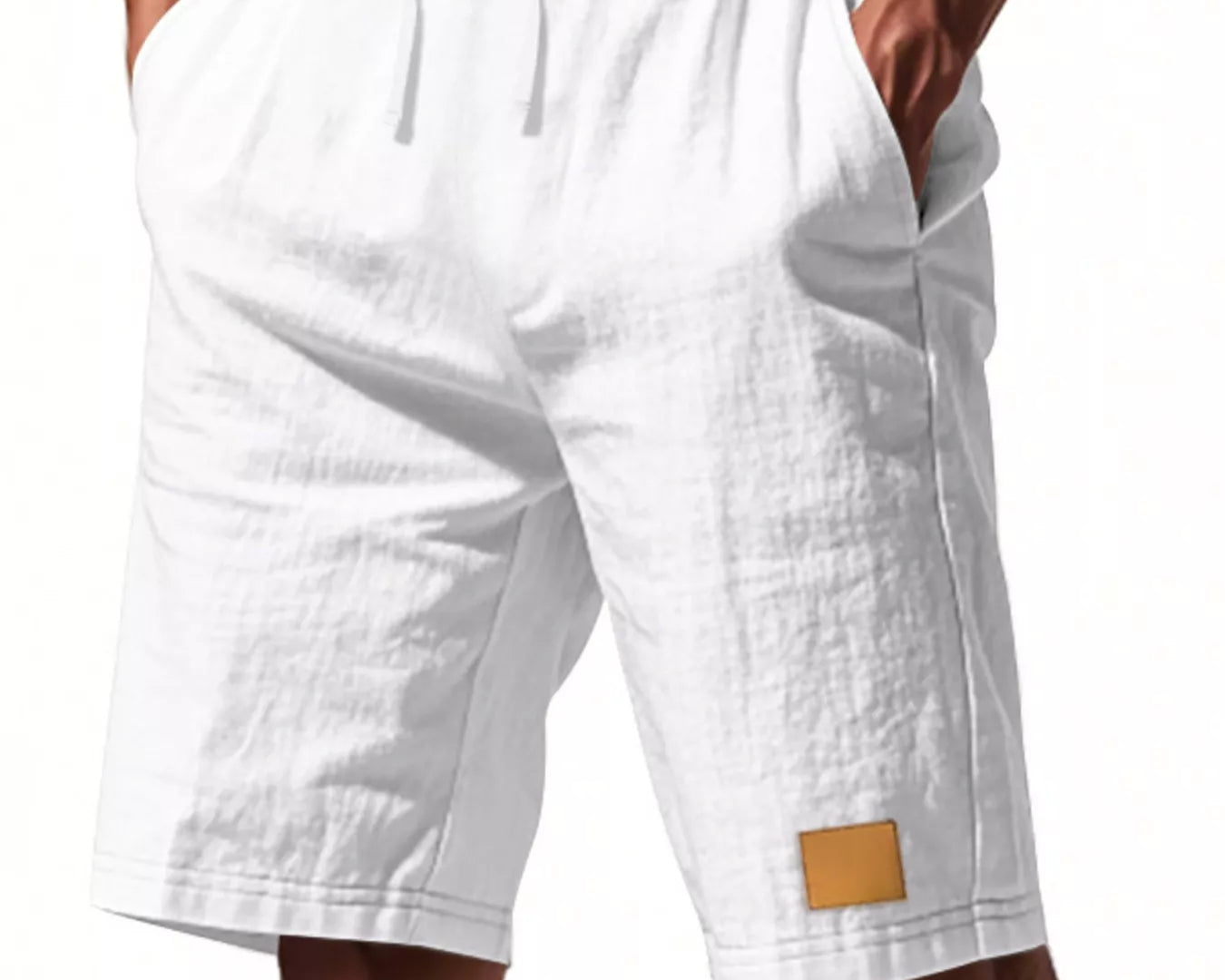 NEWYORKLISTED ATLAS MEN'S COLLECTION: White shorts with a small brown patch on a white background