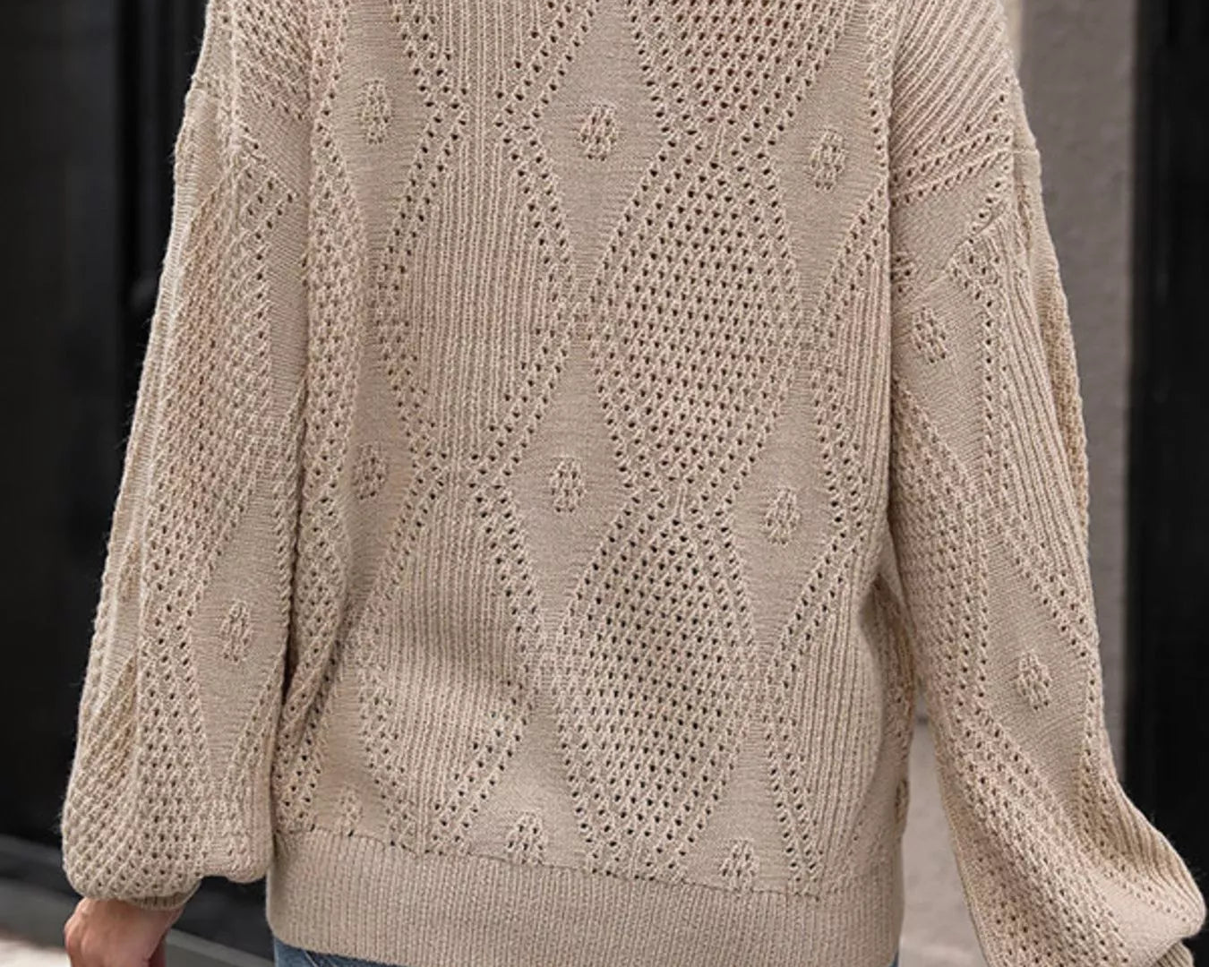 NEWYORKLISTED STYLE COLLECTION: Beige knitted sweater with a geometric pattern worn by a person, standing against a neutral background.