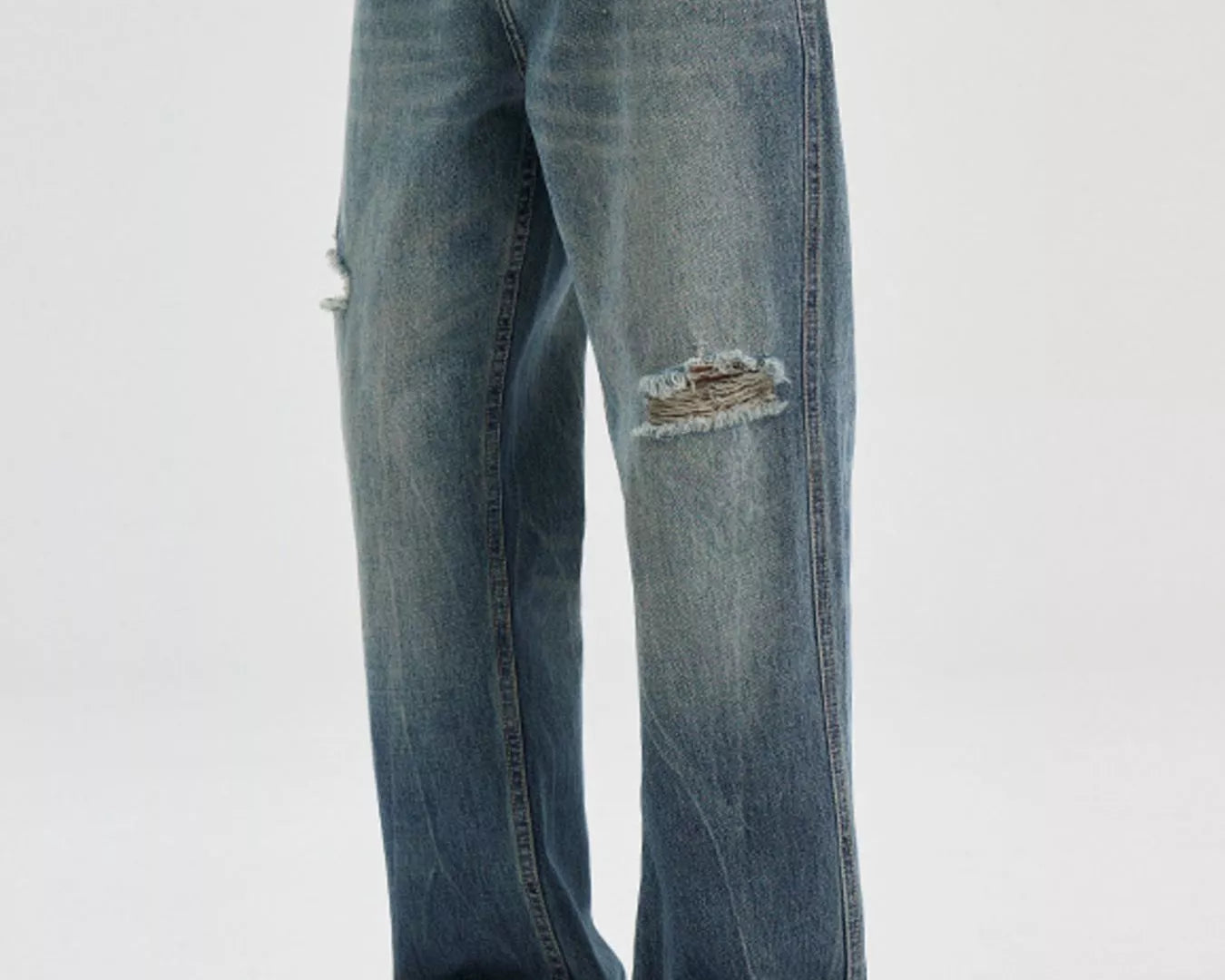 NEWYORKLISTED ATLAS MEN's COLLECTION: Person wearing blue jeans with a slight distressed look on a white background