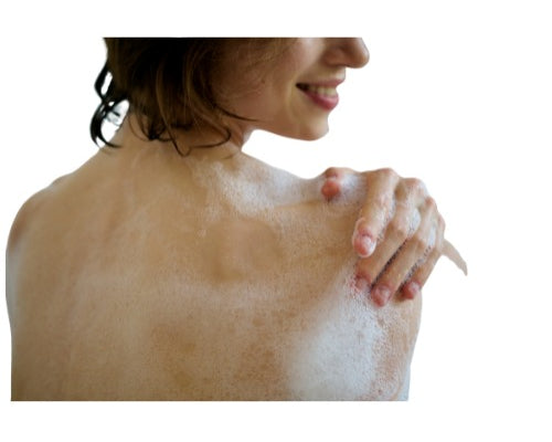 Person with soap suds on their shoulders against a white background