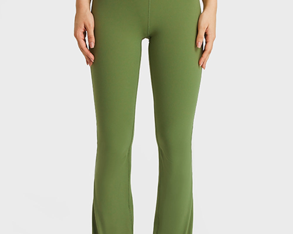 NEWYORKLISTED ACTIVEWEAR COLLECTION: Person wearing green leggings and white top on a plain background