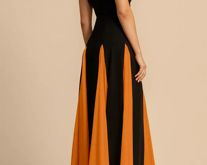 NEWYORKLISTED STYLE COLLECTION: Black and orange dress with a slit on a beige background