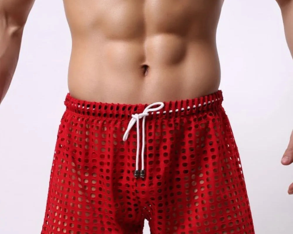 NEWYORKLISTED ATLAS MEN'S COLLECTION: Red swim shorts worn by a person on a plain background