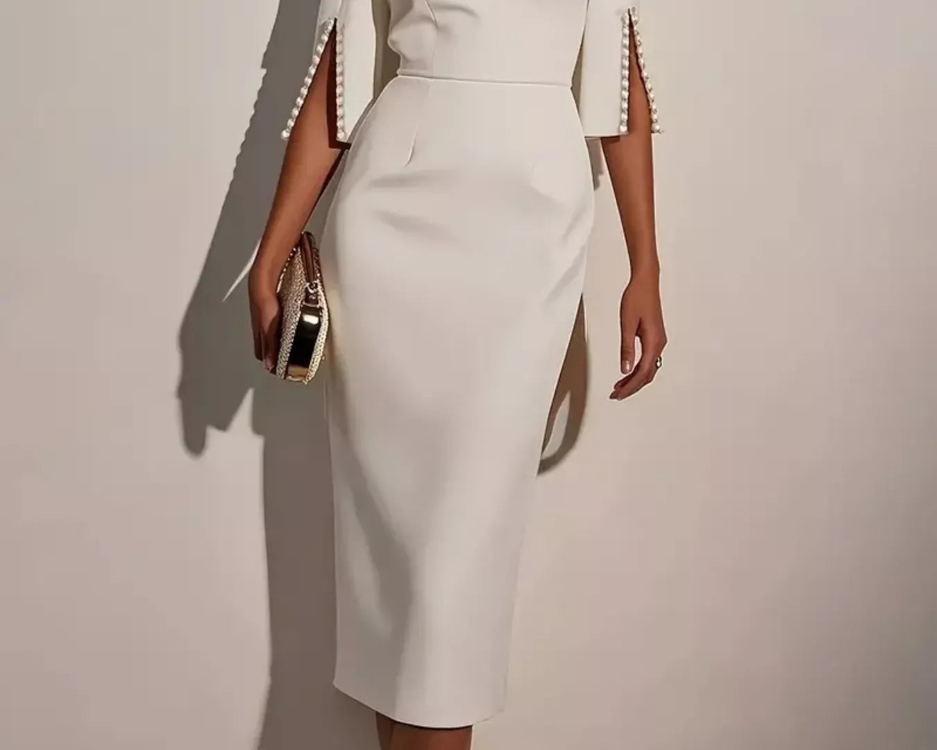 NEWYORKLISTED STYLE COLLECTION: White dress with embellished sleeves on a plain background