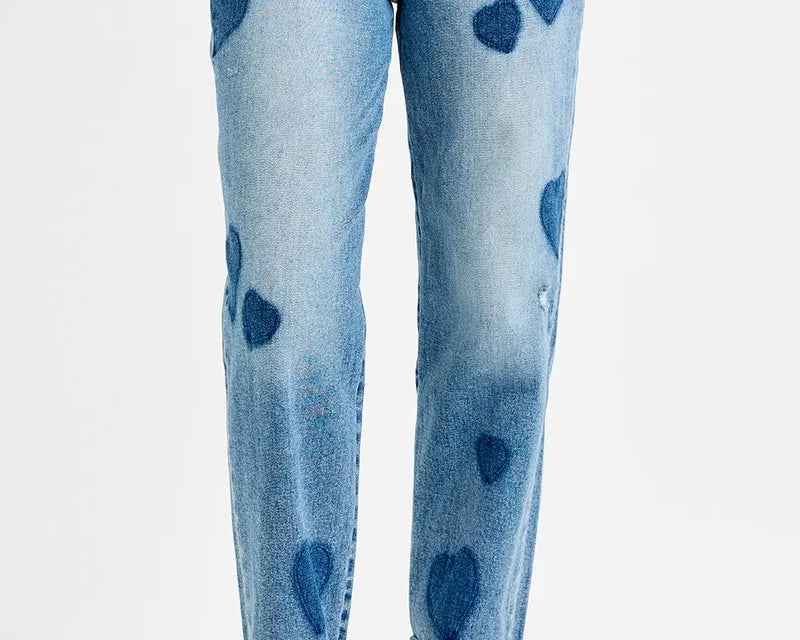 Light wash mid-rise boyfriend jeans with subtle heart print, rolled cuffs, and relaxed fit — NEWYORKLISTED STYLE COLLECTION.
