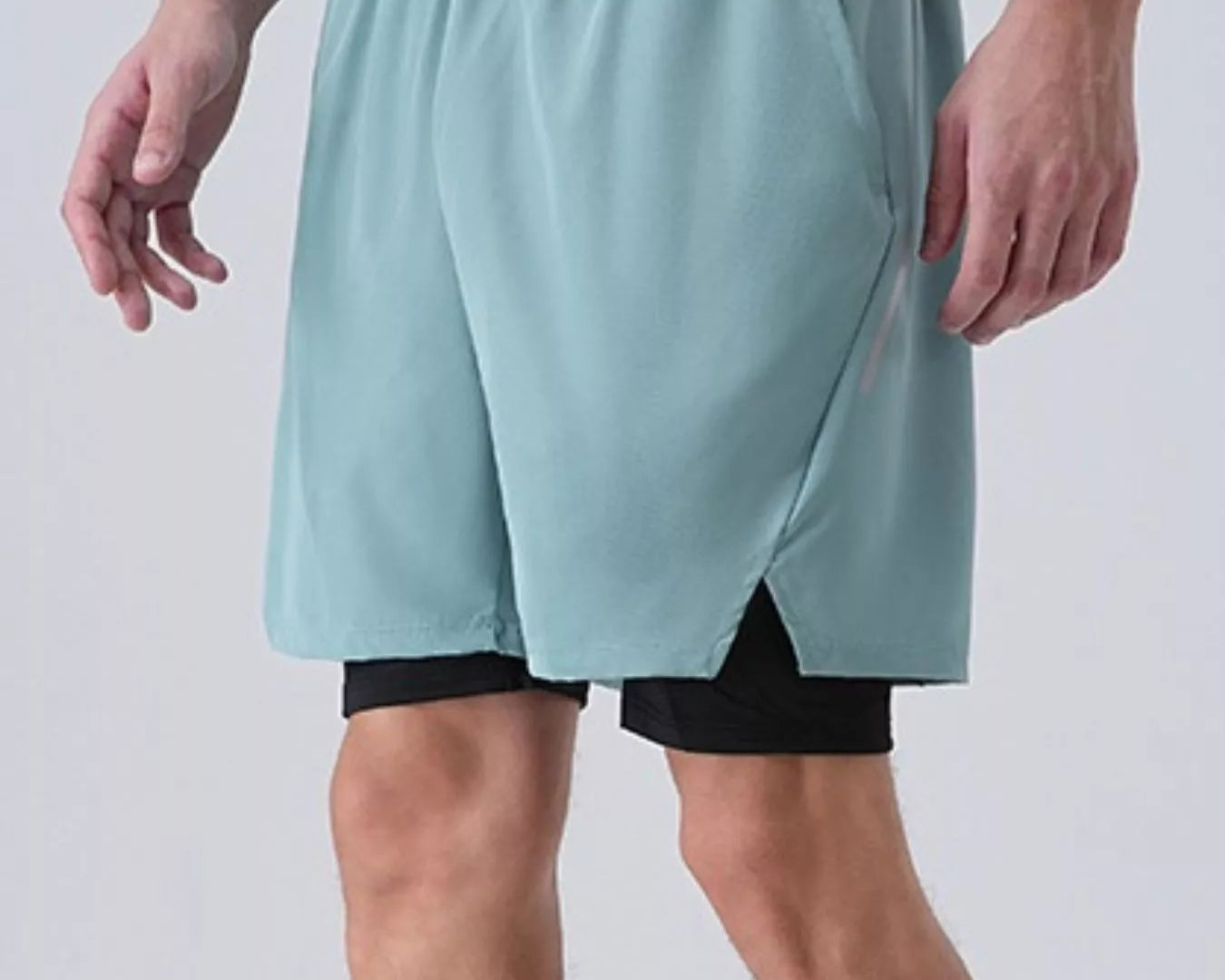 NEWYORKLISTED ATLAS MEN's COLLECTION: Men's Elastic Waist Active Shorts Light blue athletic shorts worn by a person on a plain background