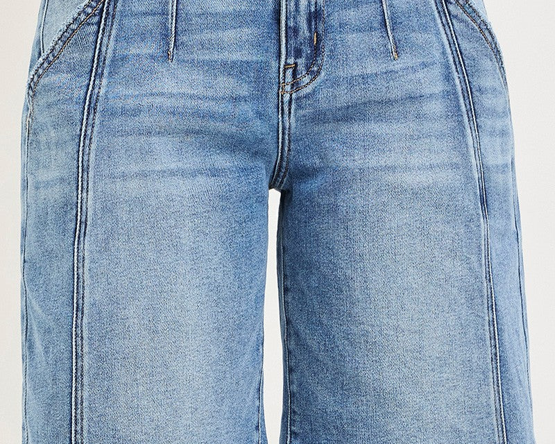 NEWYORKLISTED STYLE COLLECTION: Blue denim shorts worn by a person on a white background