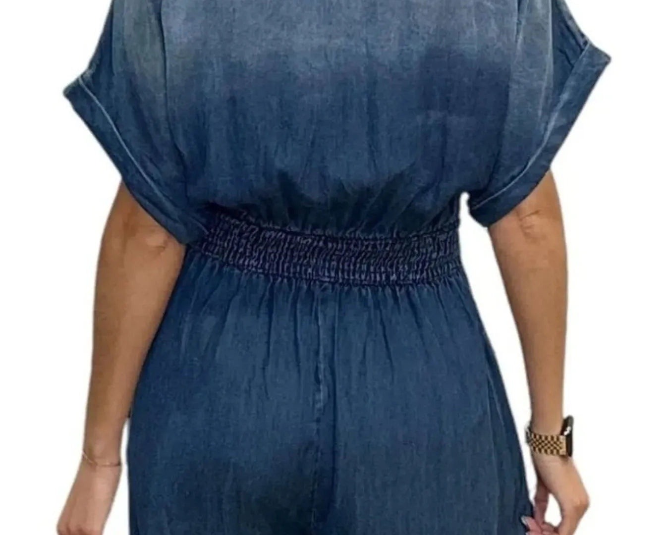 NEWYORKLISTED STYLE COLLECTION: Blue denim jumpsuit worn by a person on a white background