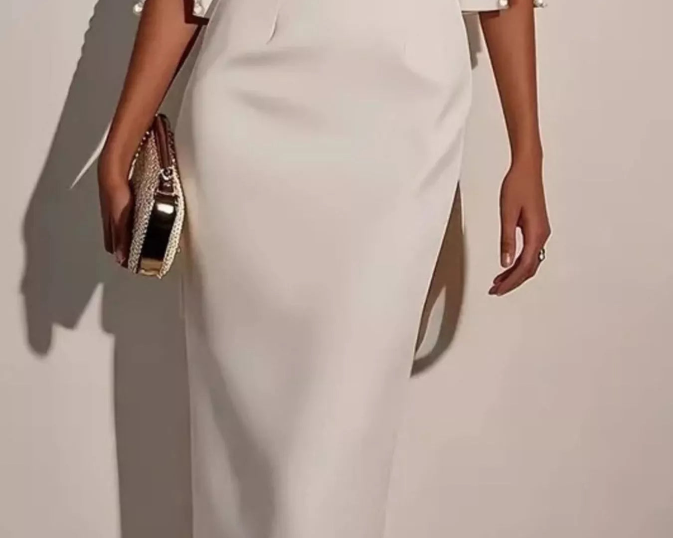 NEWYORKLISTED STYLE COLLECTION: White outfit with a skirt and jacket on a plain background
