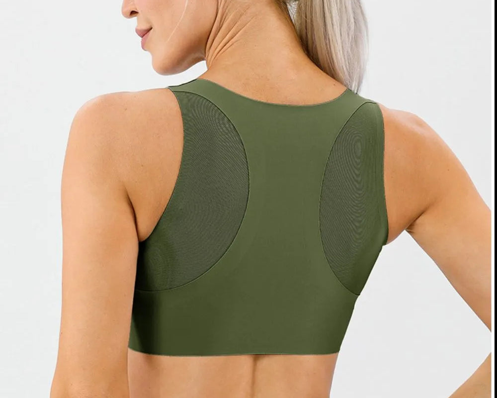 NEWYORKLISTED ACTIVEWEAR COLLECTION: Woman wearing a green sports bra and leggings on a white background