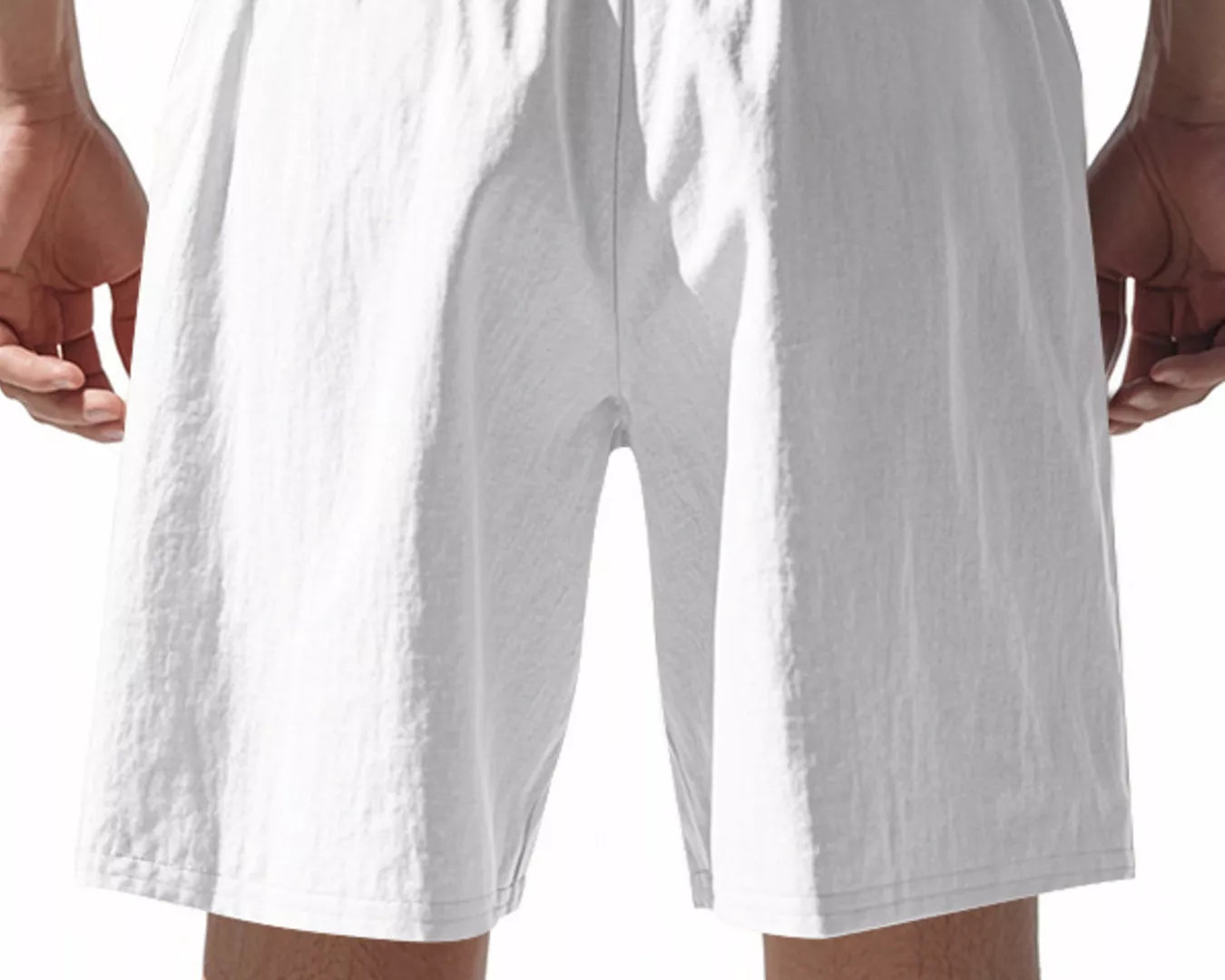 NEWYORKLISTED ATLAS MEN'S COLLECTION: White shorts worn by a person on a white background