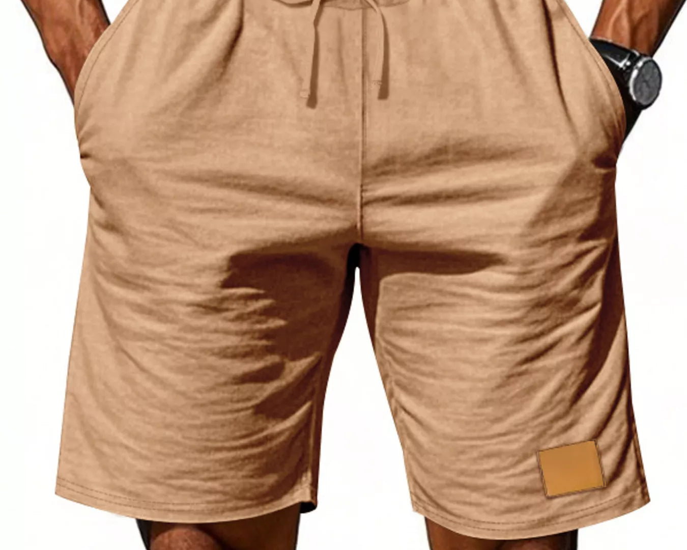 NEWYORKLISTED ATLAS MEN'S COLLECTION: Beige shorts worn by a person on a white background