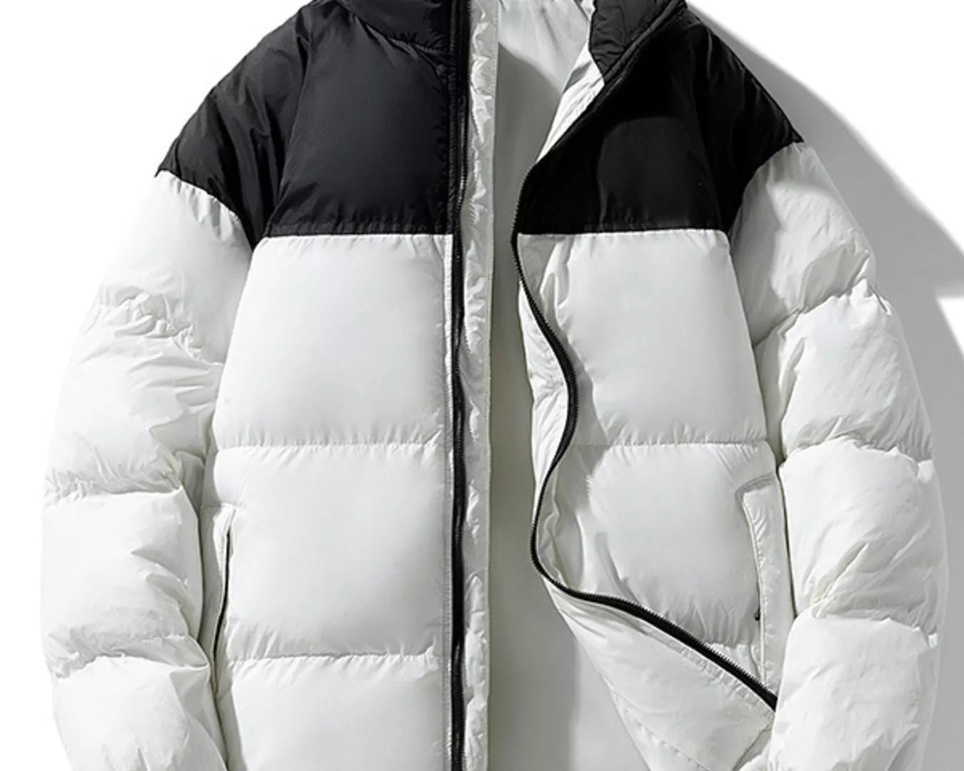 NEWYORKLISTED ATLAS MEN’S COLLECTION: White puffer jacket with black accents on a white background