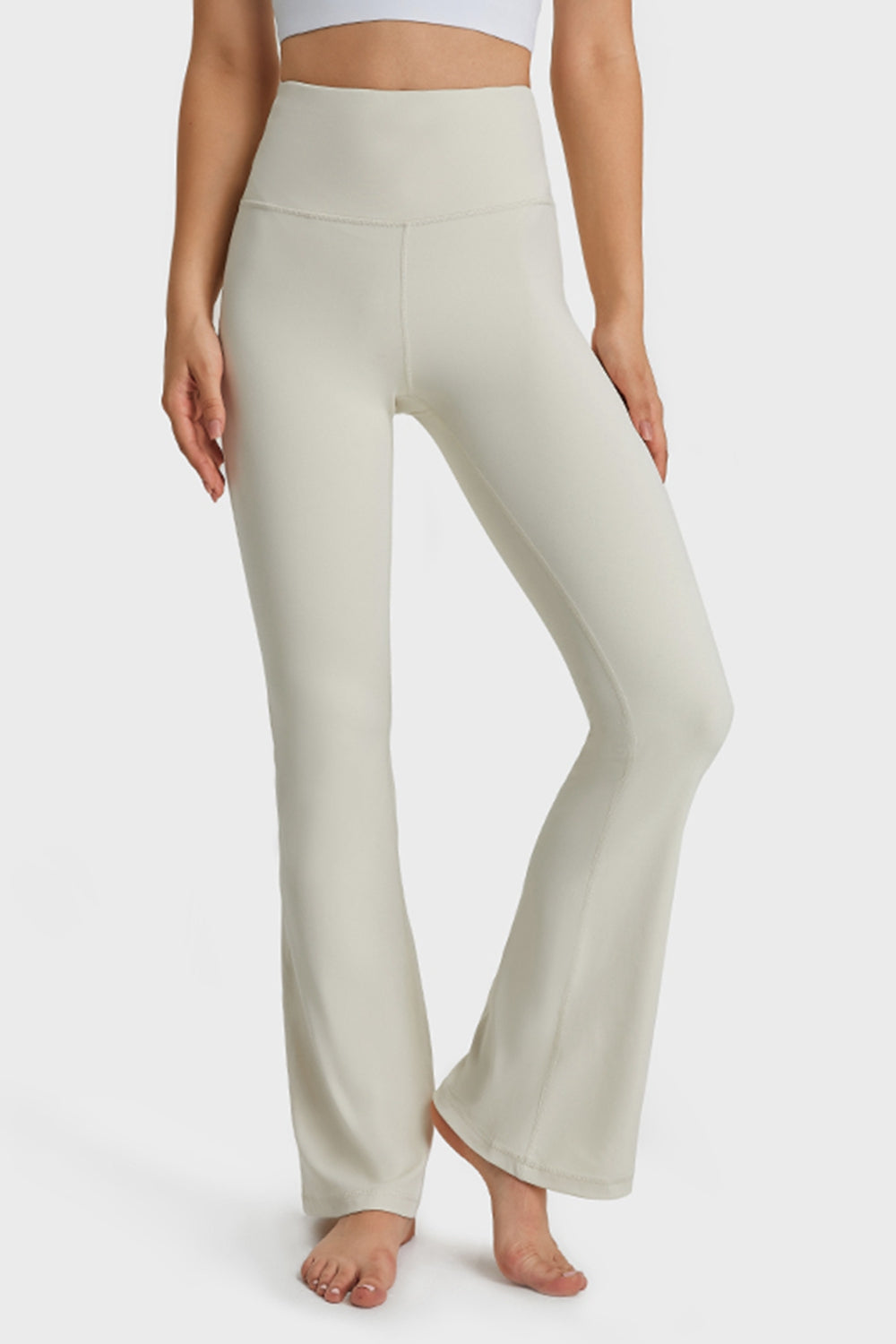 NEWYORKLISTED ACTIVEWEAR COLLECTION: Person wearing light-colored yoga pants on a white background