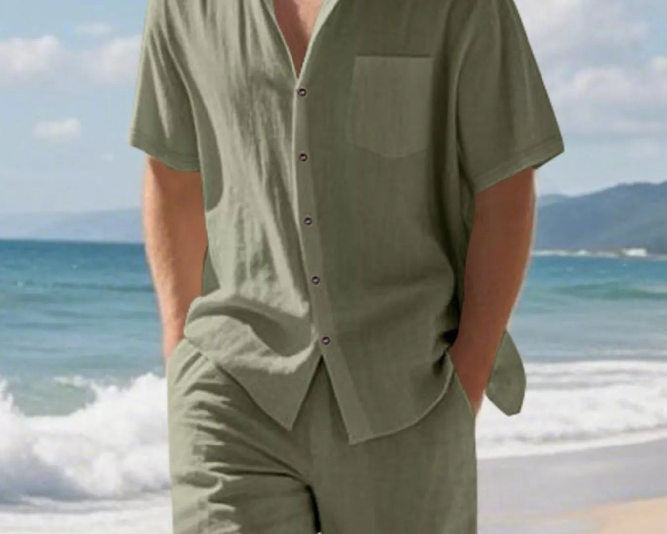 NEWYORKLISTED ATLAS MEN'S COLLECTION: Man wearing a green shirt and shorts on a beach with ocean and sky in the background