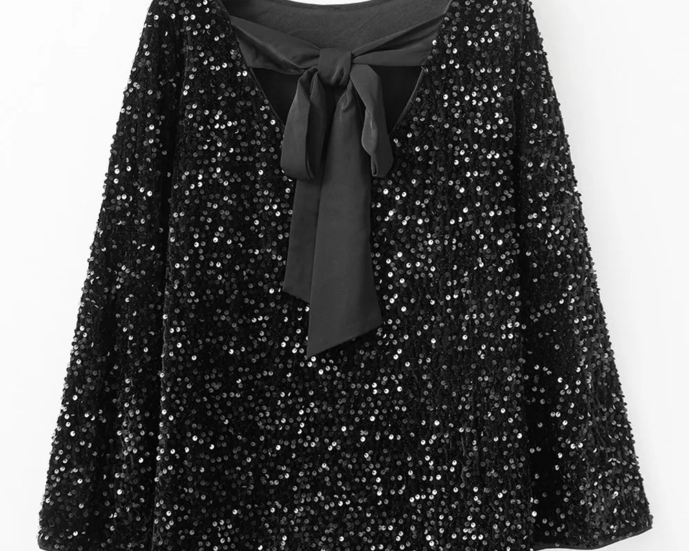 NEWYORKLISTED Valentine's Day Specials: Black sequin dress with a black bow tie on a hanger against a white background