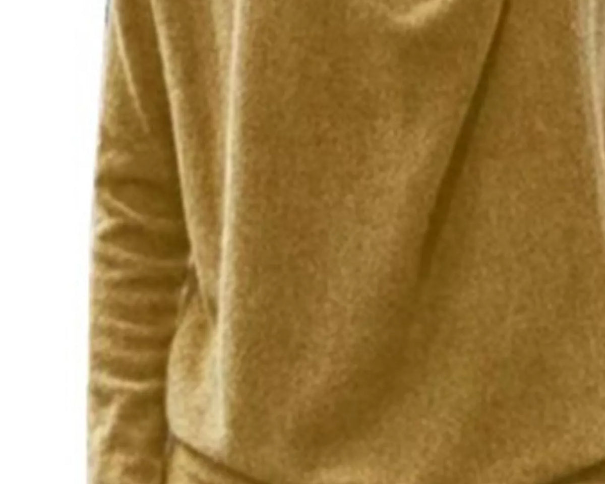 NEWYORKLISTED STYLE COLLECTION: Close-up of a mustard yellow long-sleeve shirt with a brand logo on a white background
