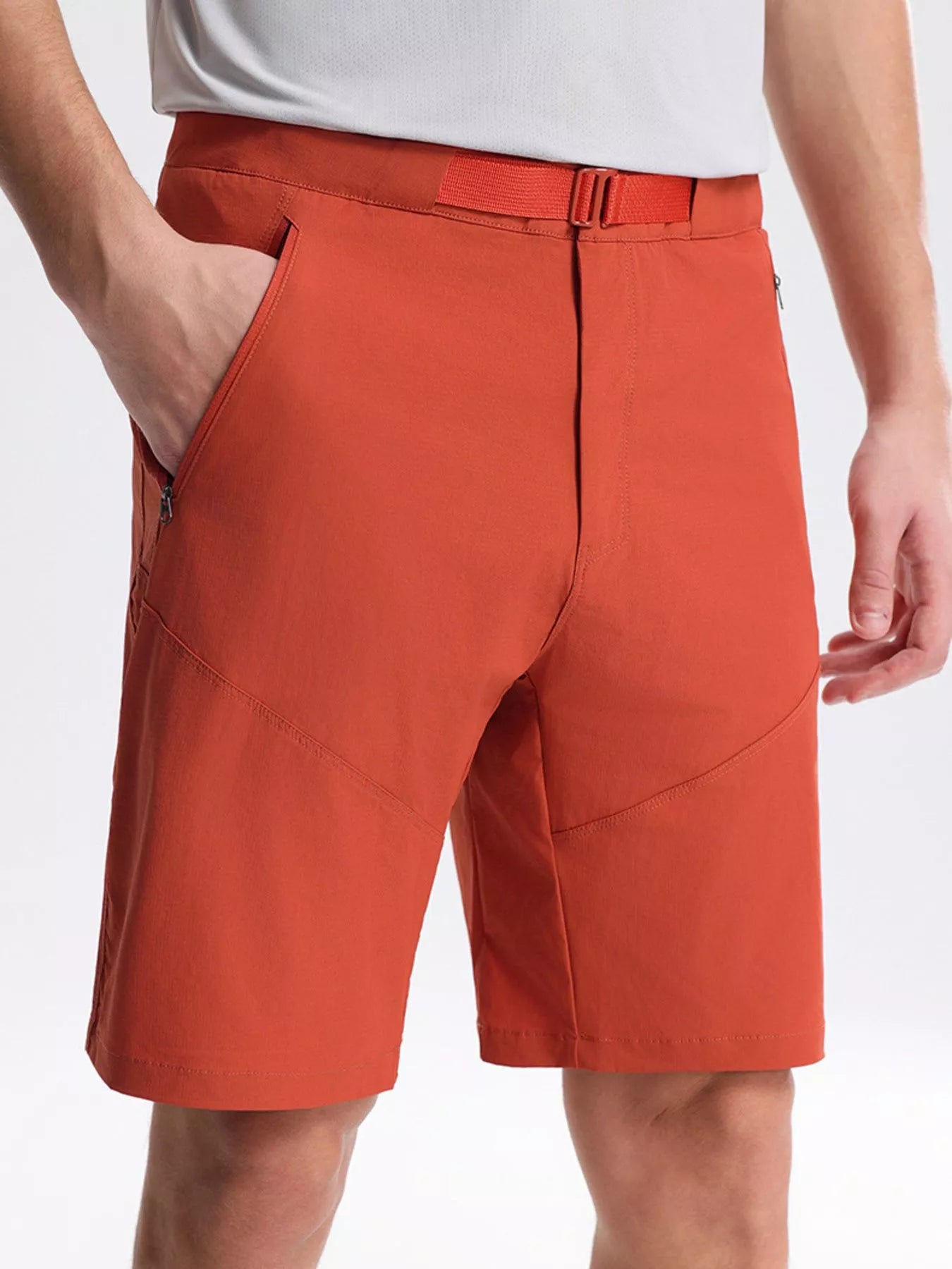 NEWYORKLISTED ATLAS MEN's COLLECTION: Orange shorts worn by a person on a white background