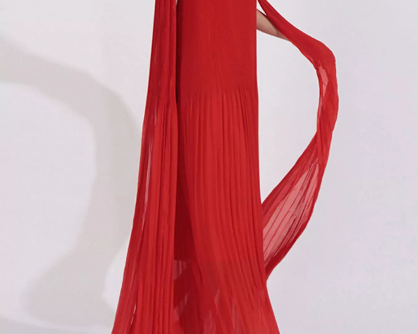 NEWYORKLISTED STYLE COLLECTION: Red off-shoulder dress with floral details on a white background