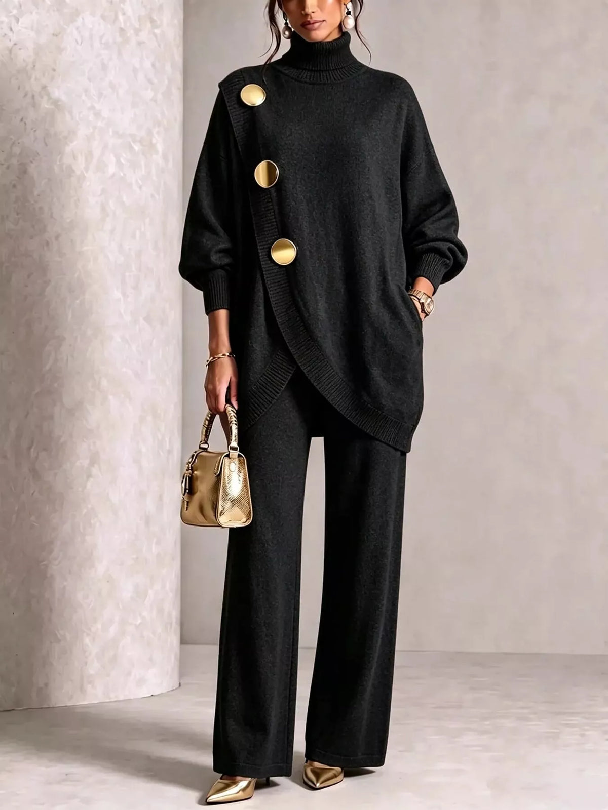 NEWYORKLISTED STYLE COLLECTION: A model wearing a black knit turtleneck sweater with oversized sleeves and three prominent gold buttons, paired with black wide-leg trousers and holding a small metallic gold handbag.