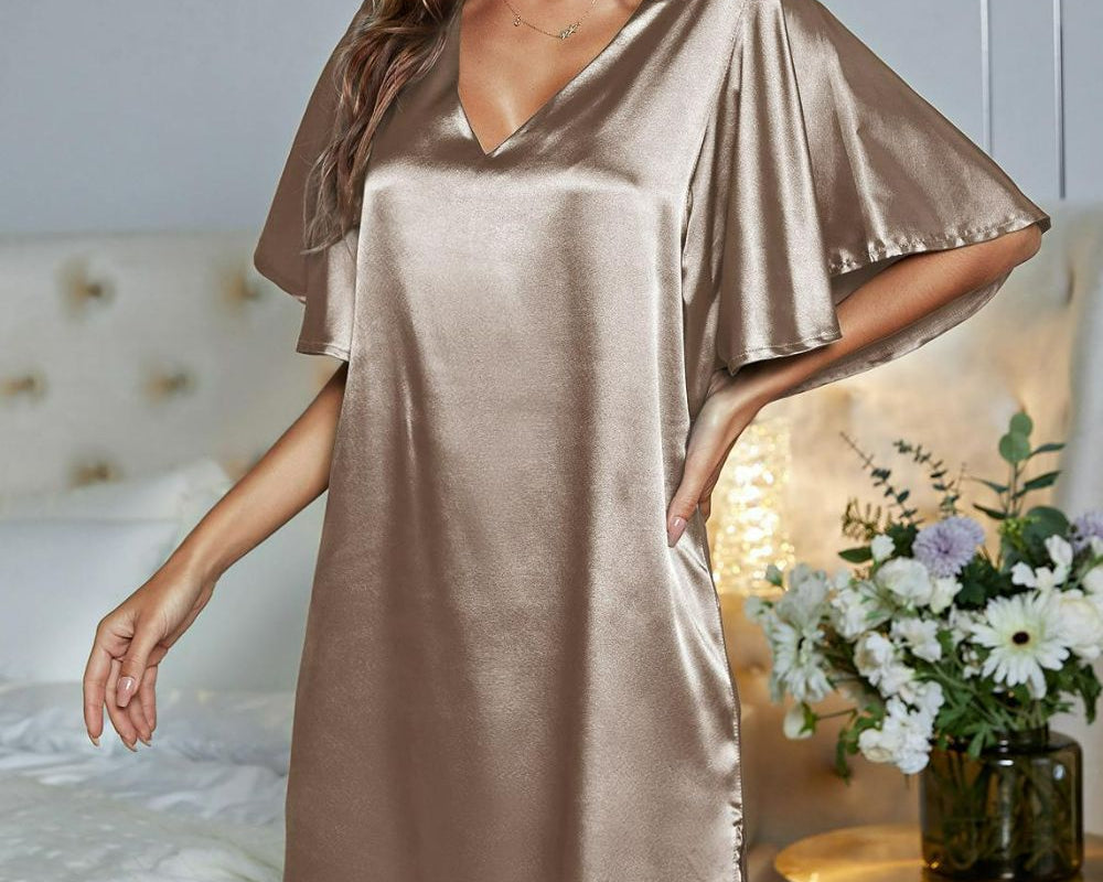 NEWYORKLISTED Intimate Apparel: Woman wearing a satin nightgown in a bedroom setting