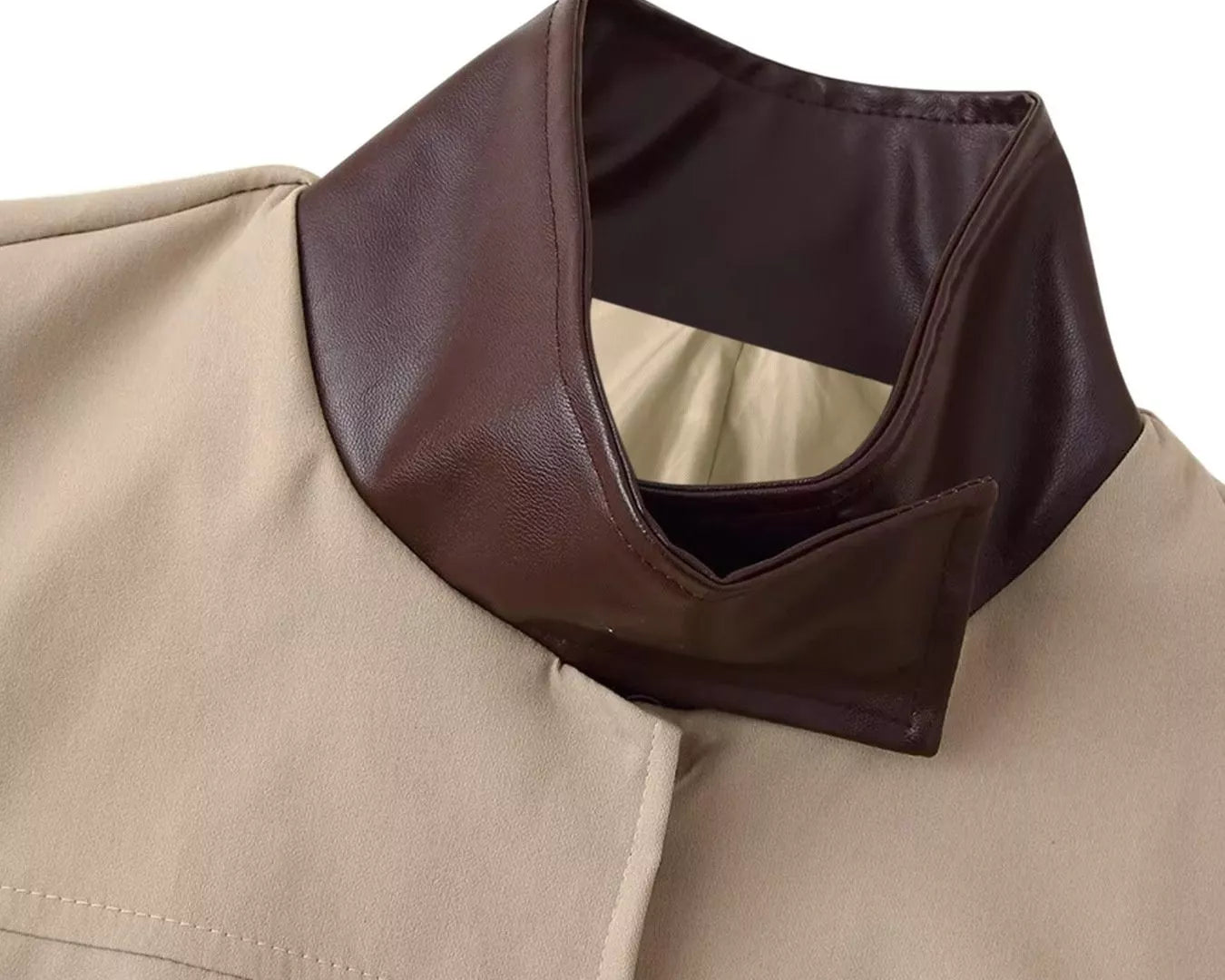 NEWYORKLISTED STYLE COLLECTION Close-up of a beige coat with a brown collar on a white background