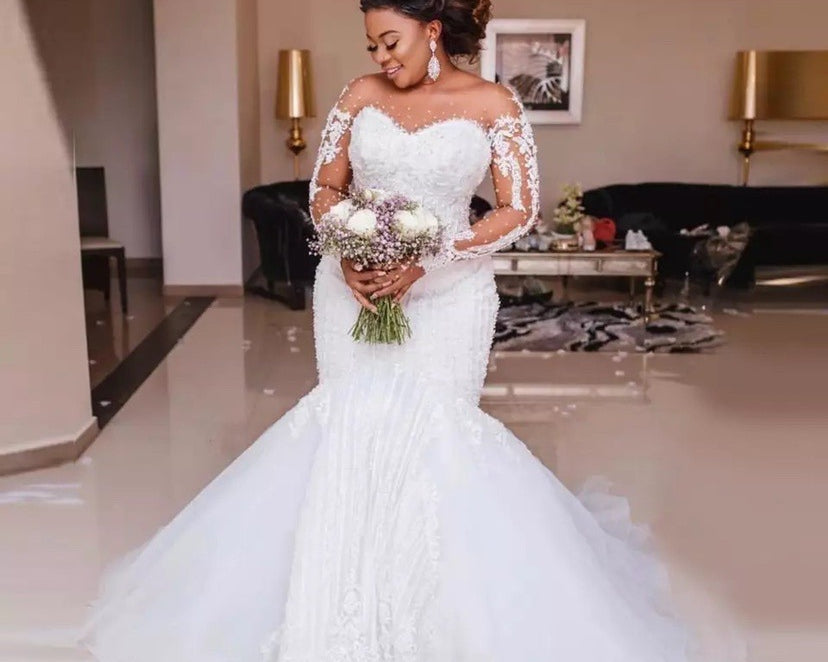 Vintage long sleeve lace ball gown wedding dress with sterling silver-toned embroidery, available in sizes 2–26W from NEWYORKLISTED Elegant Bride Collection.