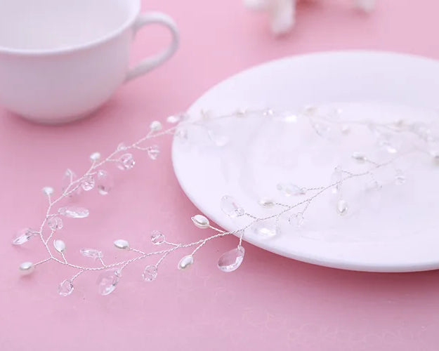 White ceramic plate with decorative elements on a pink surface