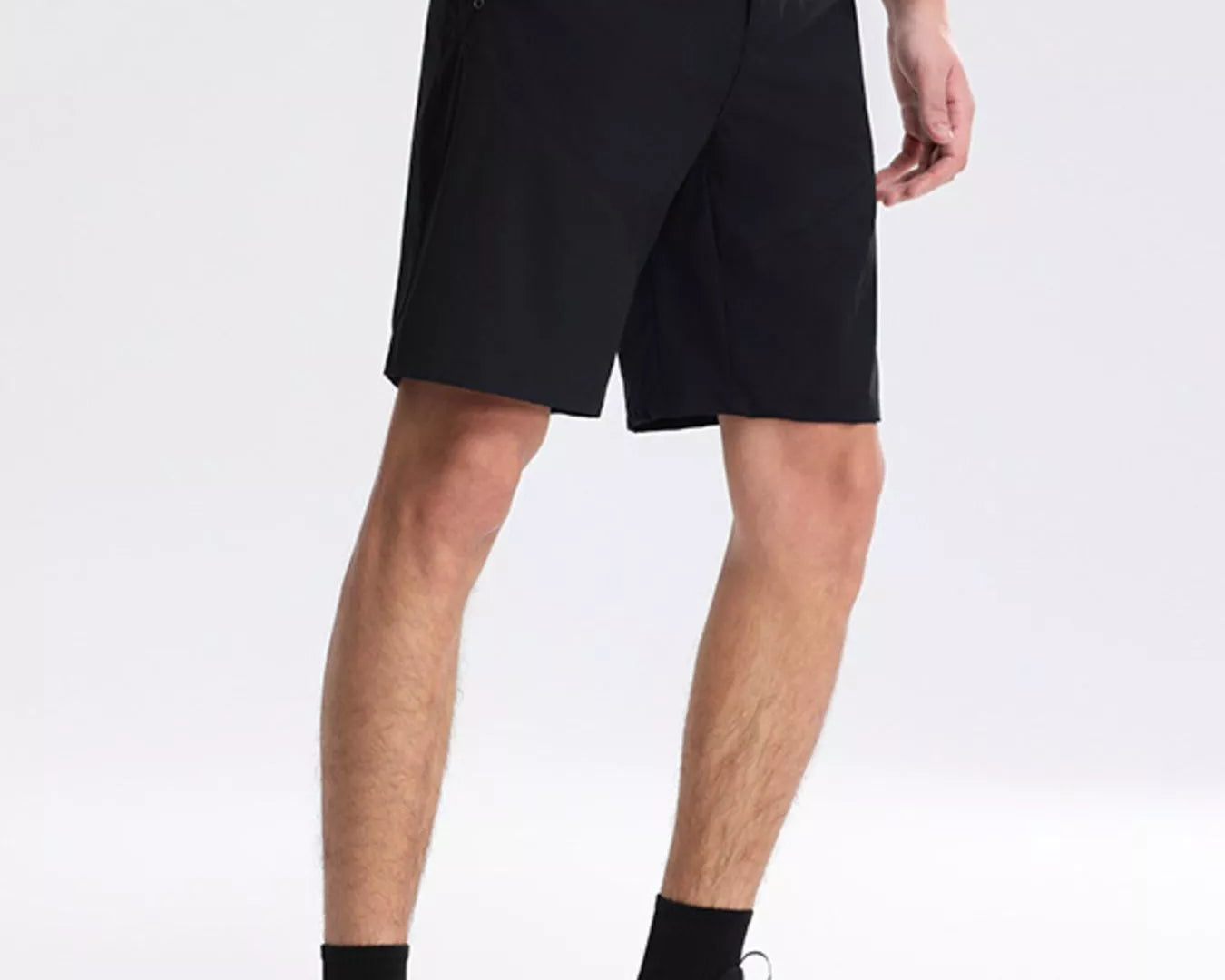 NEWYORKLISTED ATLAS MEN's COLLECTION: Person wearing black shorts on a white background
