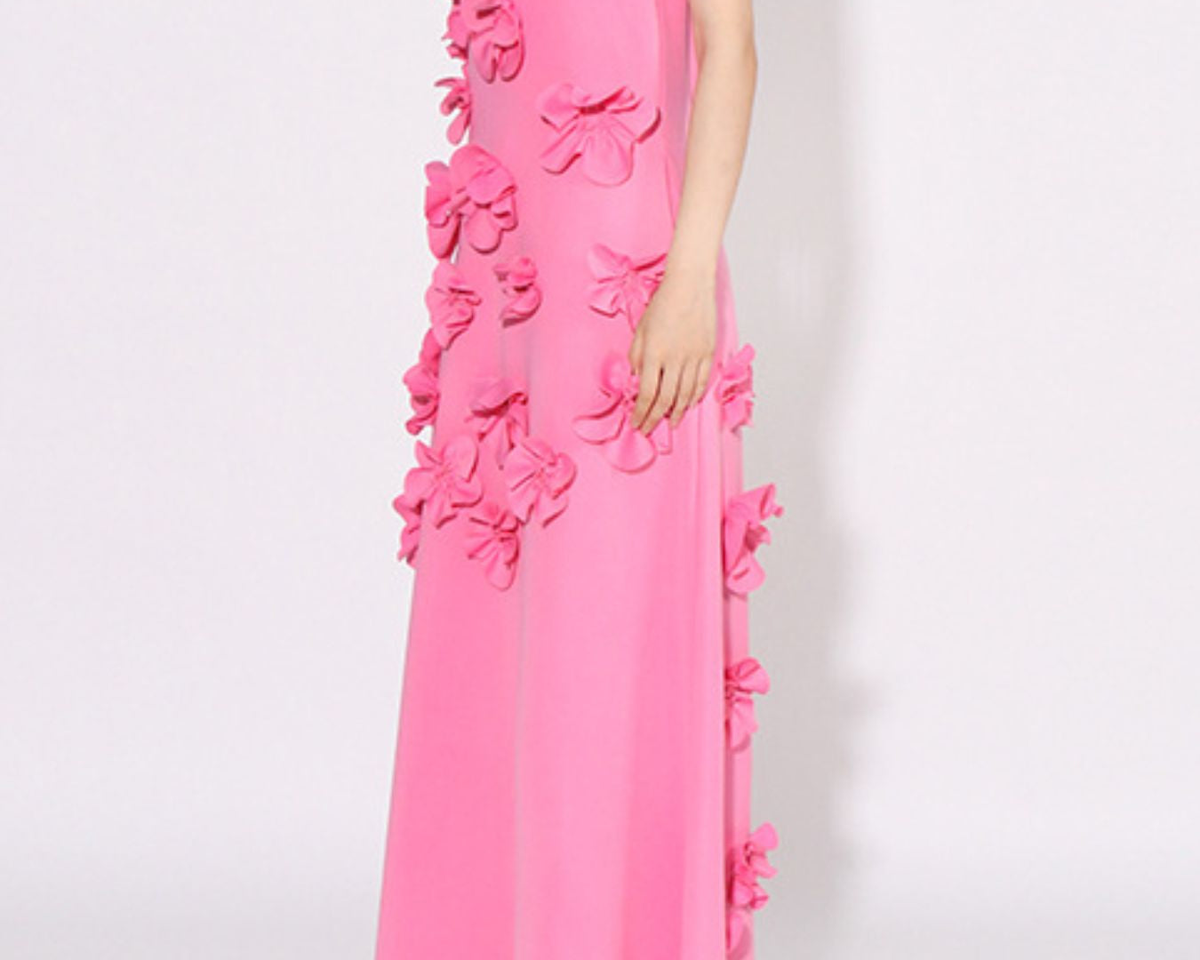 NEWYORKLISTED STYLE COLLECTION: Pink evening gown with floral embellishments on a white background