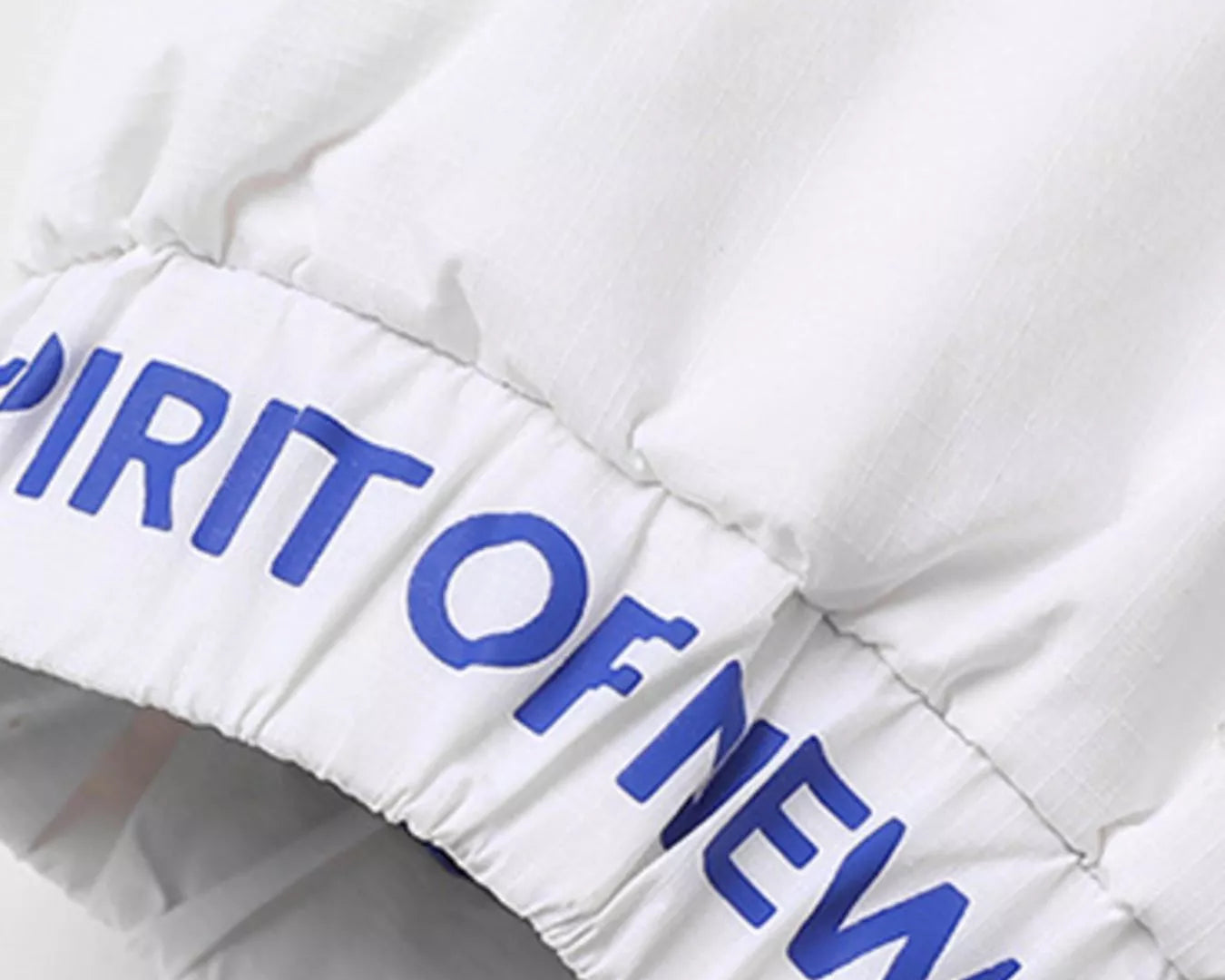 NEWYORKLISTED ATLAS MEN’S COLLECTION: White puffer jacket with blue text on a white background