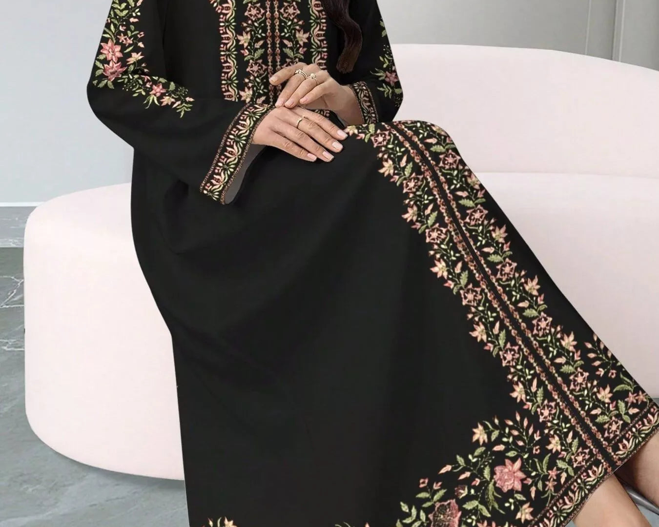 NEWYORKLISTED STYLE COLLECTION: Black dress with floral embroidery on a white chair