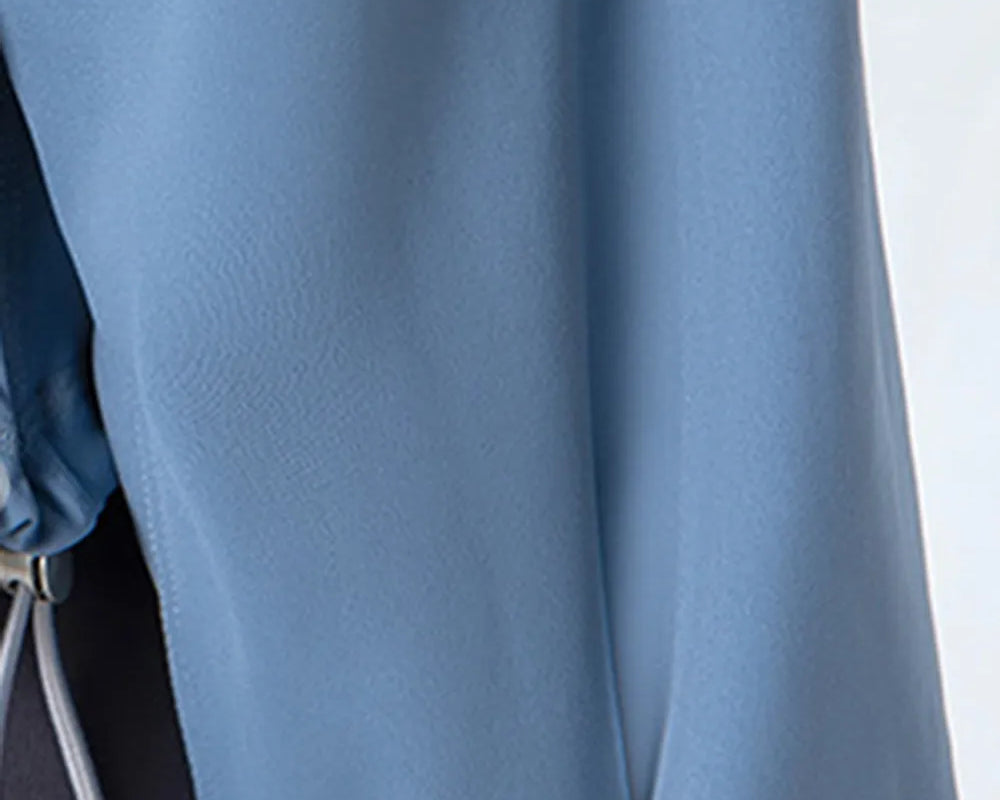 NEWYORKLISTED ACTIVEWEAR COLLECTION: Close-up of a blue garment with a blurred background