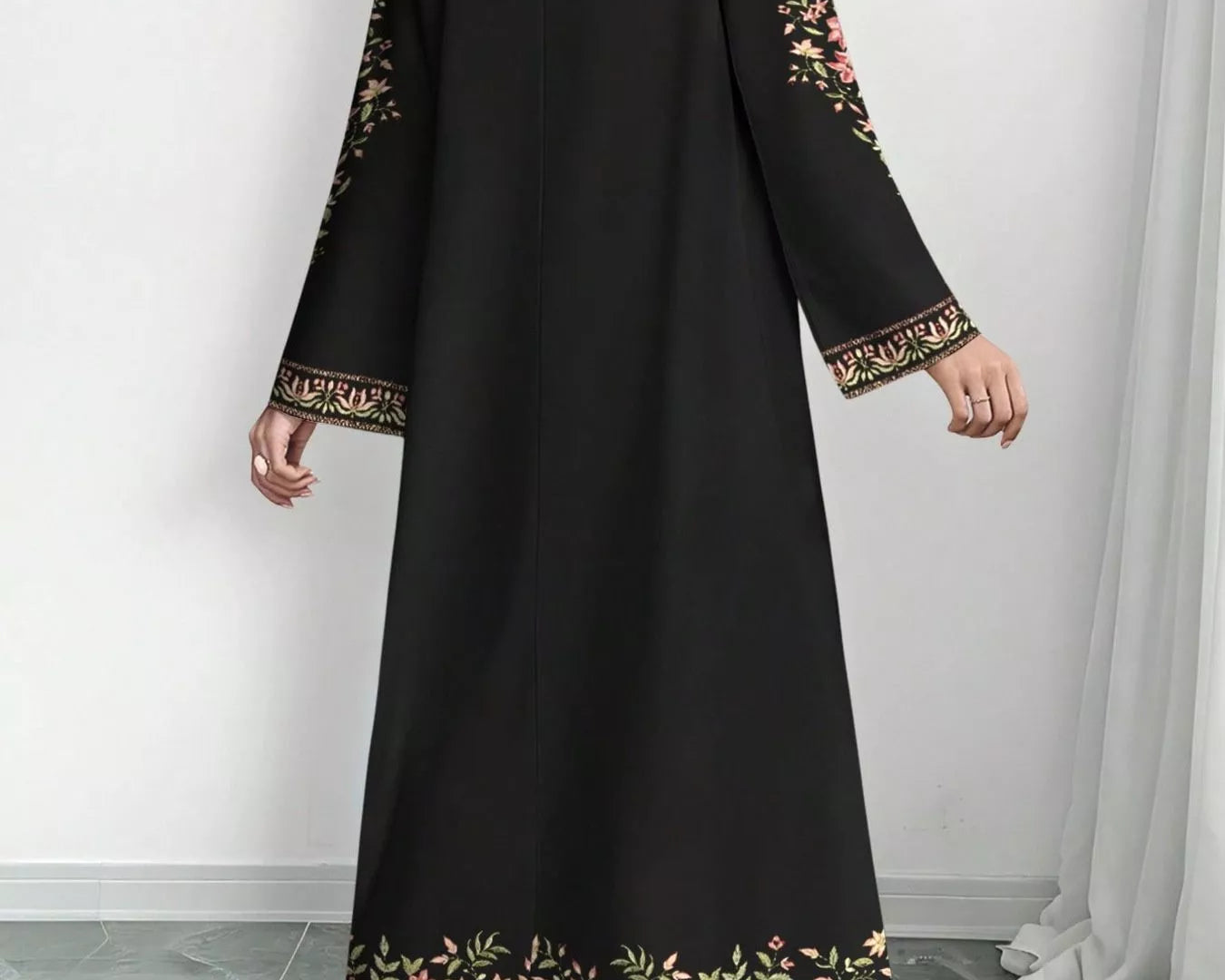 NEWYORKLISTED STYLE COLLECTION: Black dress with floral embroidery on a white background