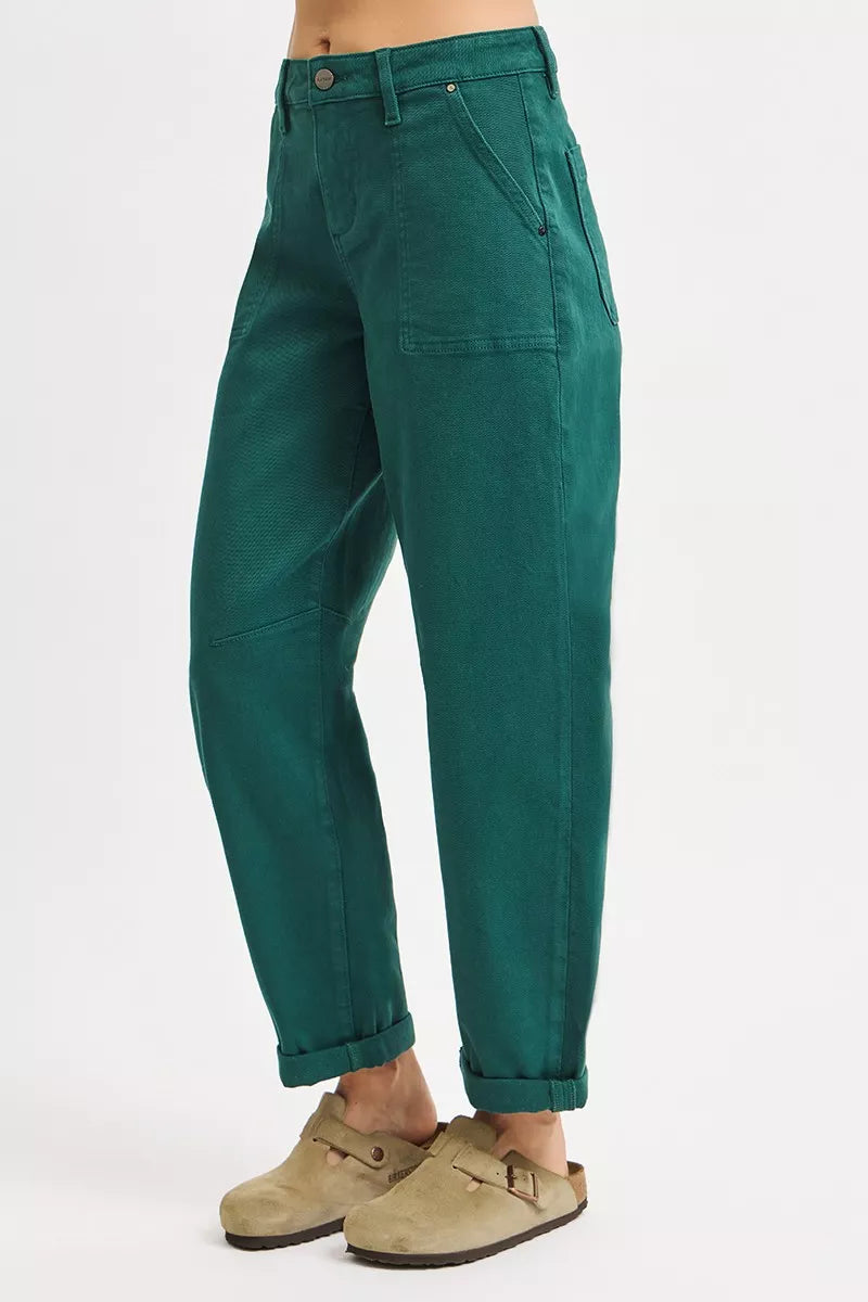 NEWYORKLISTED STYLE COLLECTION: Green pants worn by a person on a white background