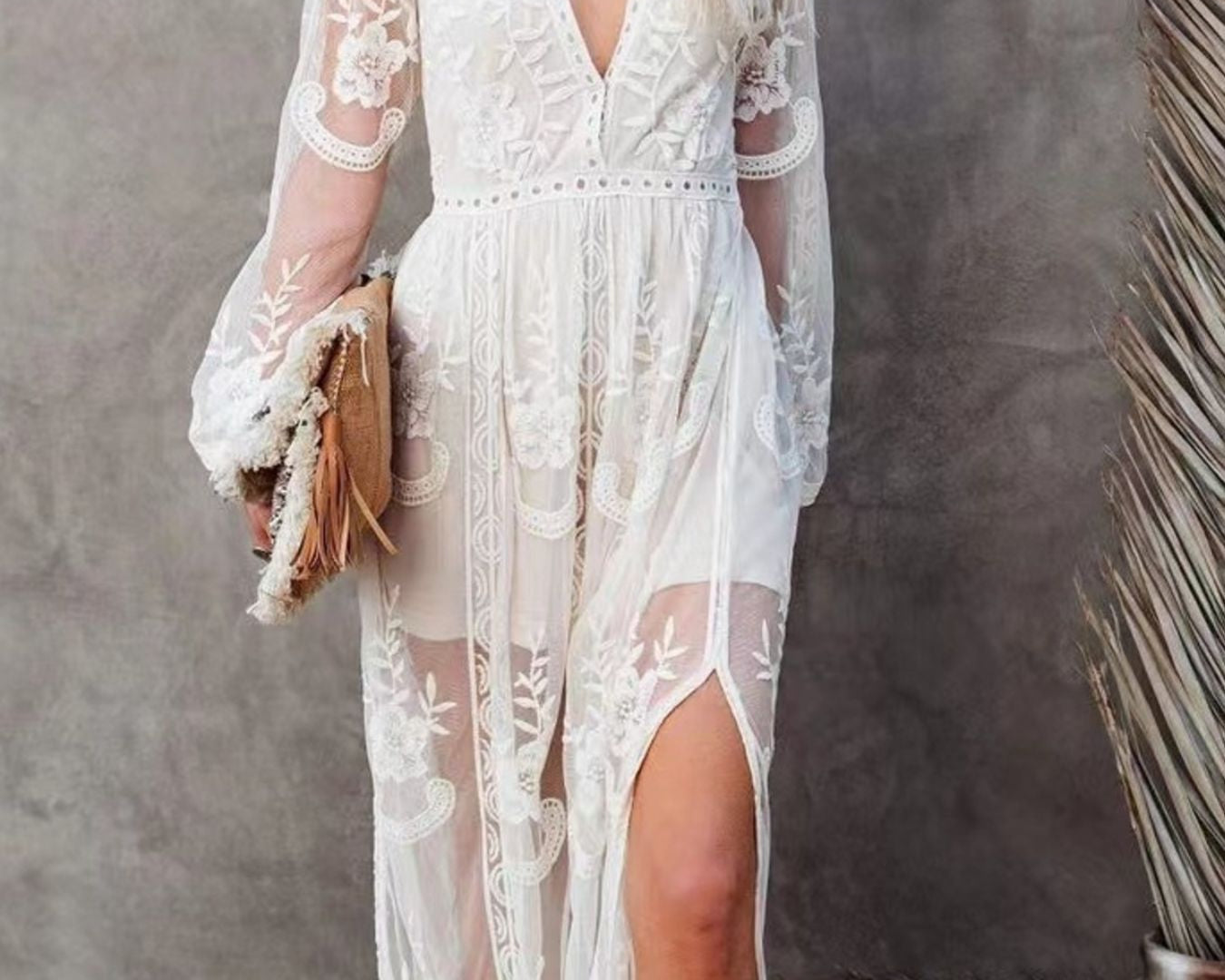 NEWYORKLISTED STYLE COLLECTION: Woman wearing a white lace dress with a gray background
