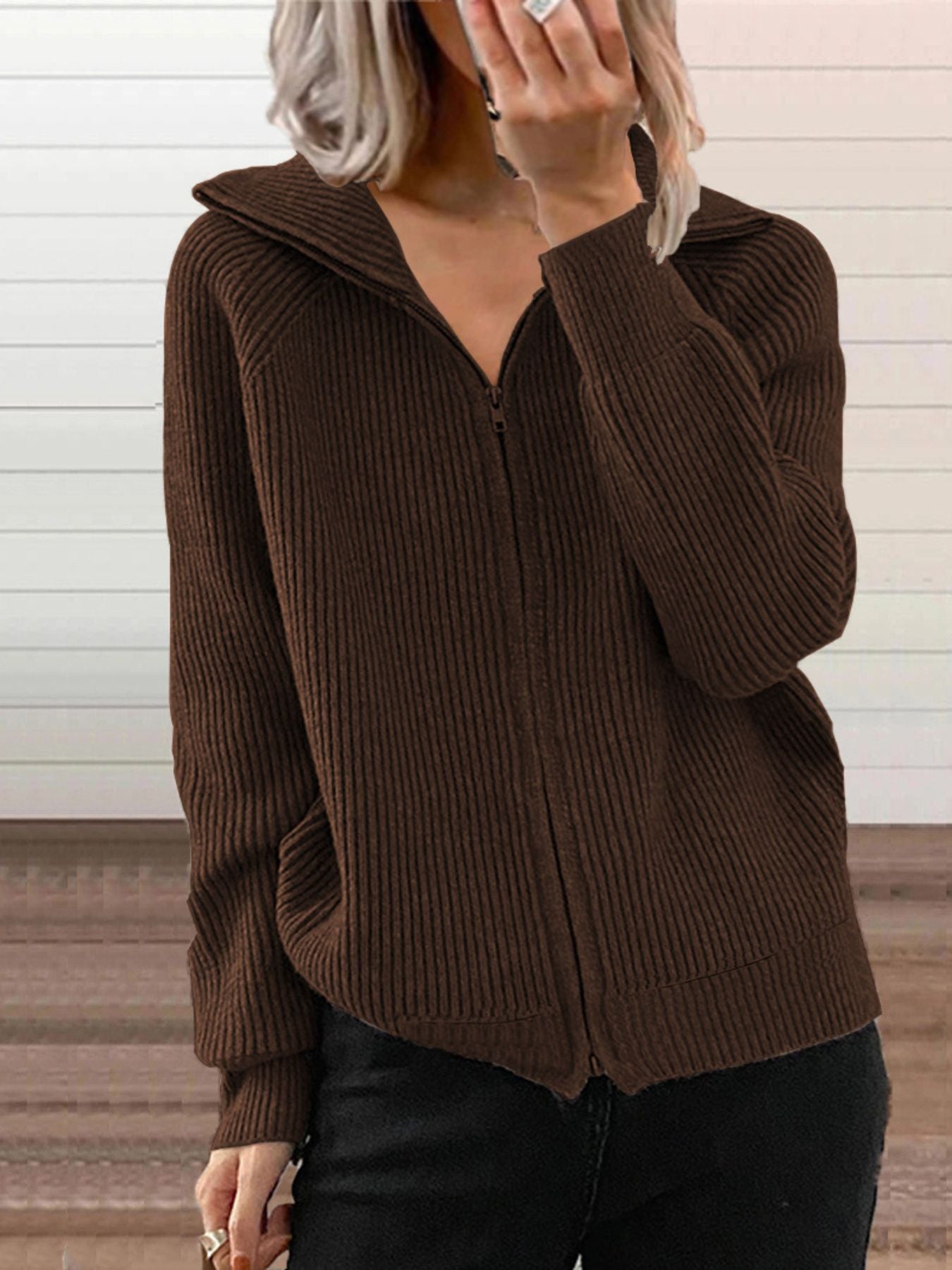 NEWYORKLISTED STYLE COLLECTION: Brown ribbed zip-up sweater worn by a person against a neutral background
