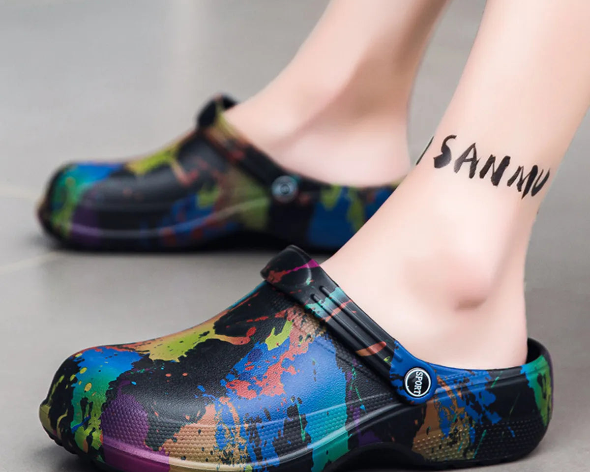 NEWYORKLISTED STYLE COLLECTION: Colorful splatter-patterned clogs worn by a person on a neutral background