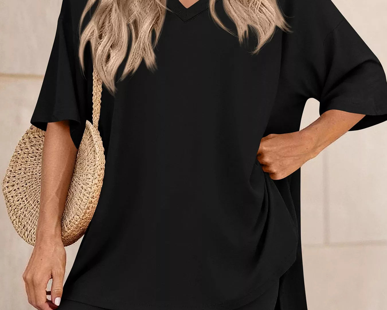 NEWYORKLISTED COMFORT COLLECTION: Woman wearing a black outfit with a beige background