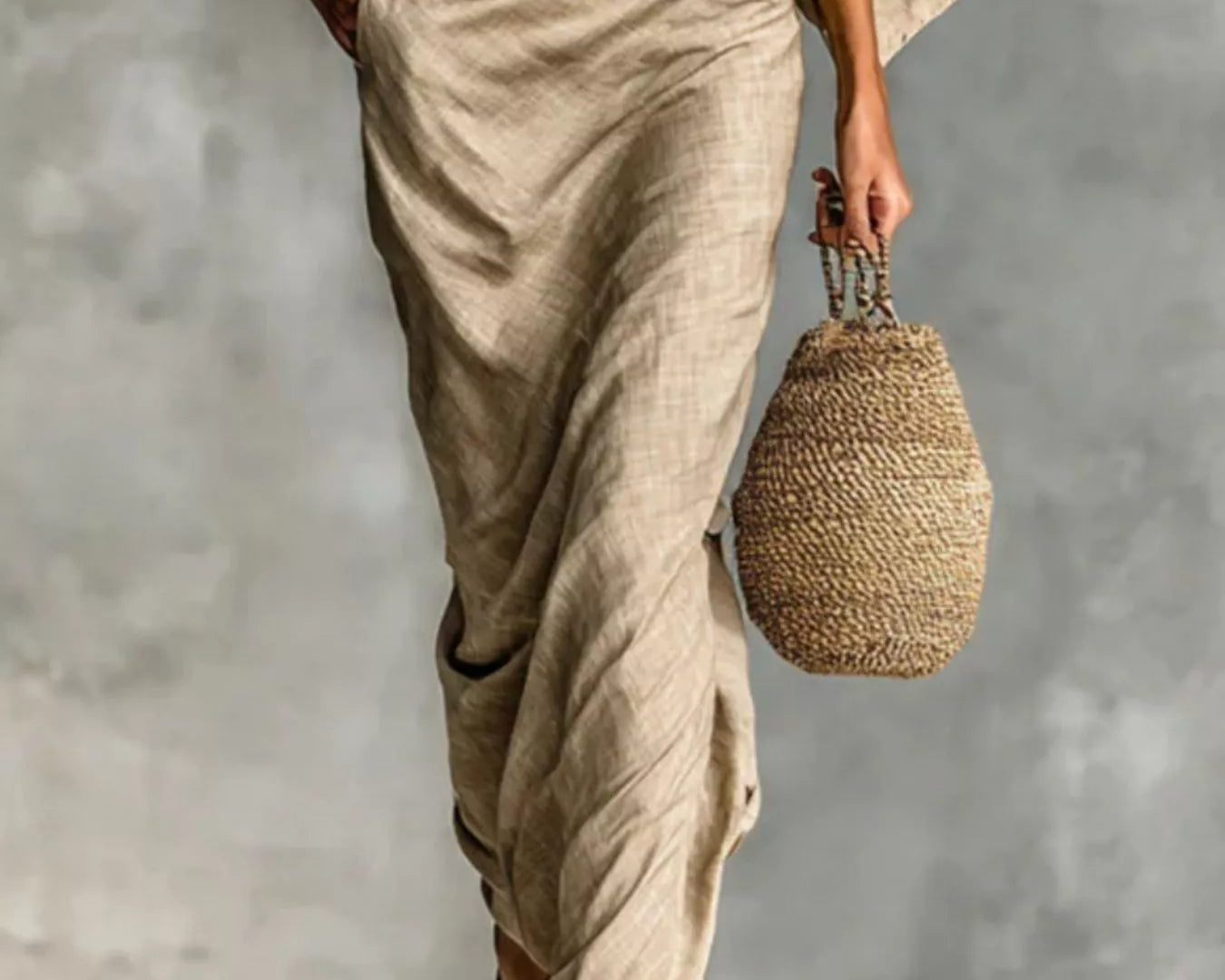 NEWYORKLISTED STYLE COLLECTION: Person wearing beige outfit holding a woven bag against a gray background