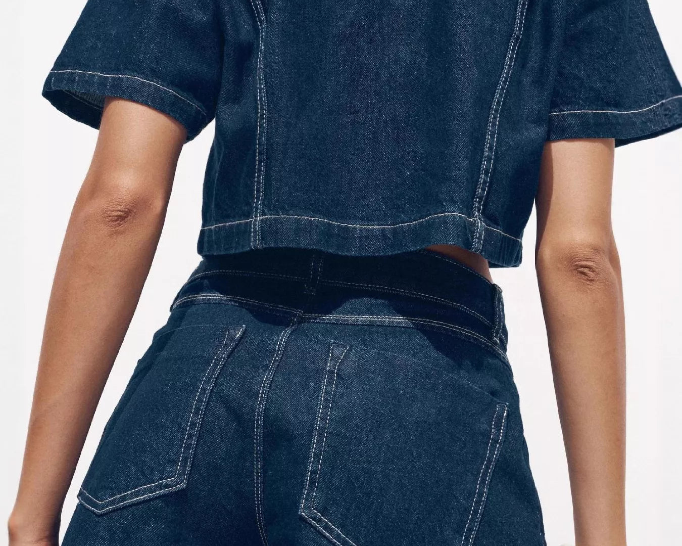 NEWYORKLISTED STYLE COLLECTION: Person wearing a blue denim outfit with a white background