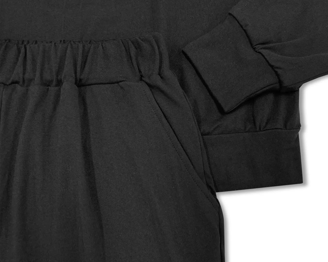 NEWYORKLISTED STYLE COLLECTION: Black dress with long sleeves on a white background