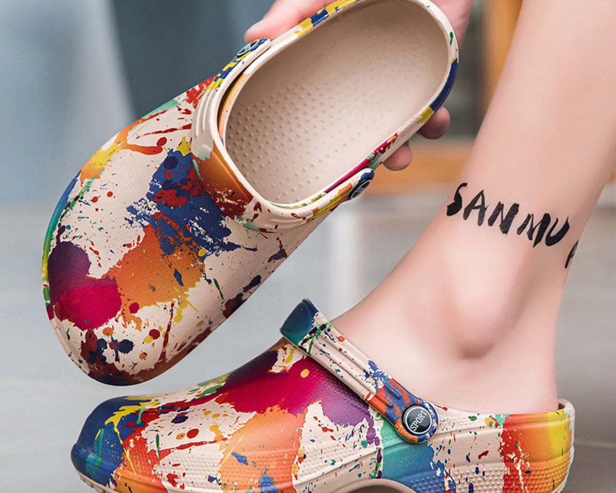 NEWYORKLISTED STYLE COLLECTION: Colorful splatter-patterned clogs being worn with a blurred background